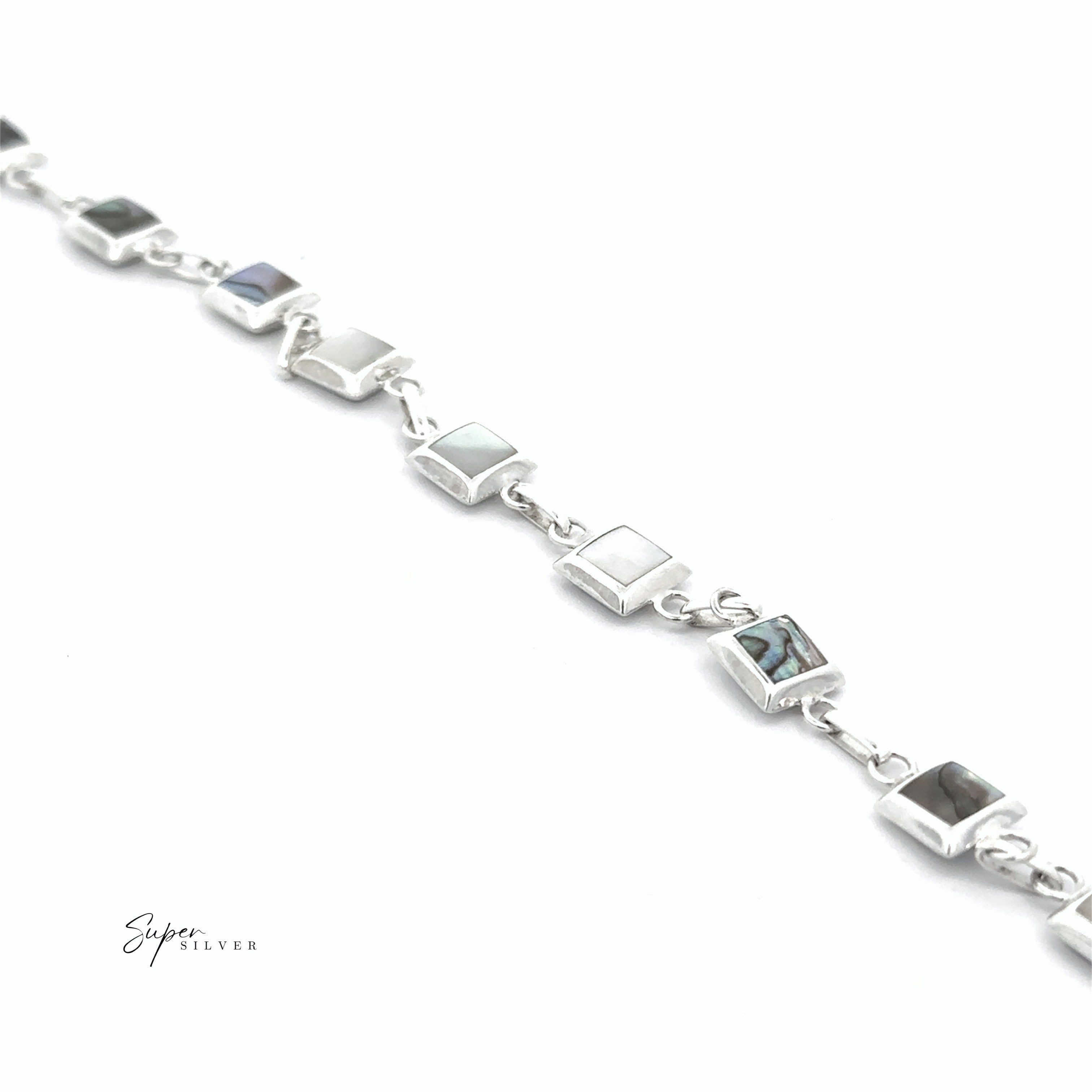 The Reversable Square Stone Inlay Bracelet features square stone inlays and is displayed diagonally on a white background.