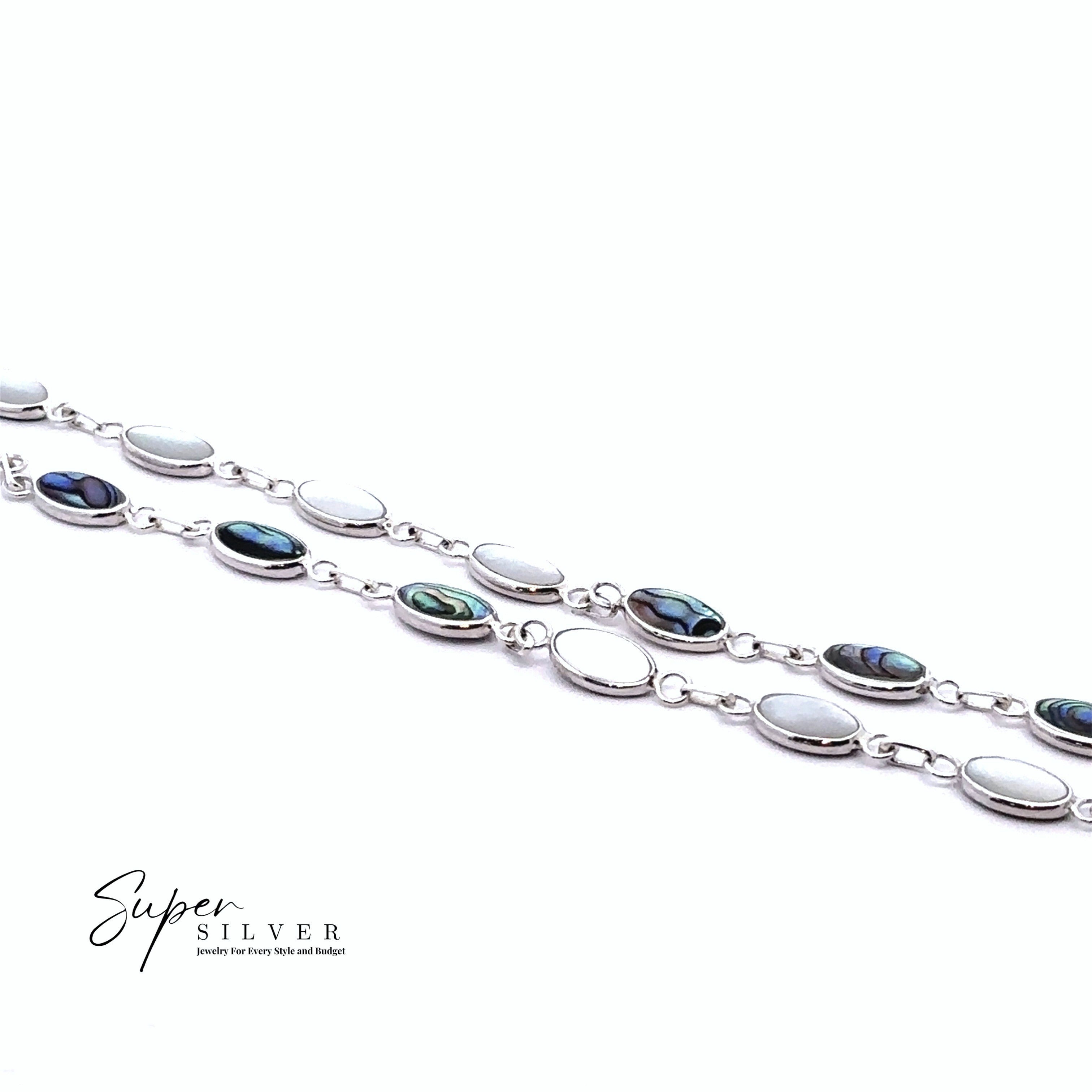 Two "Reversable Oval Shaped Inlay Stone Bracelets" with alternating white mother of pearl and abalone shell links are displayed on a white background. The "Super Silver" logo is in the lower left corner.