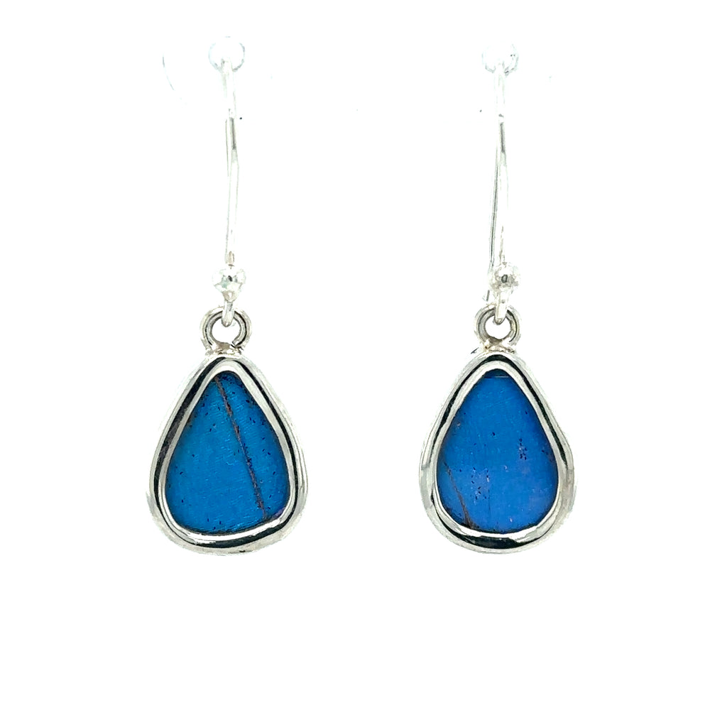 
                  
                    A pair of Small Wide Teardrop Butterfly Wing Earrings with a statement blue stone.
                  
                