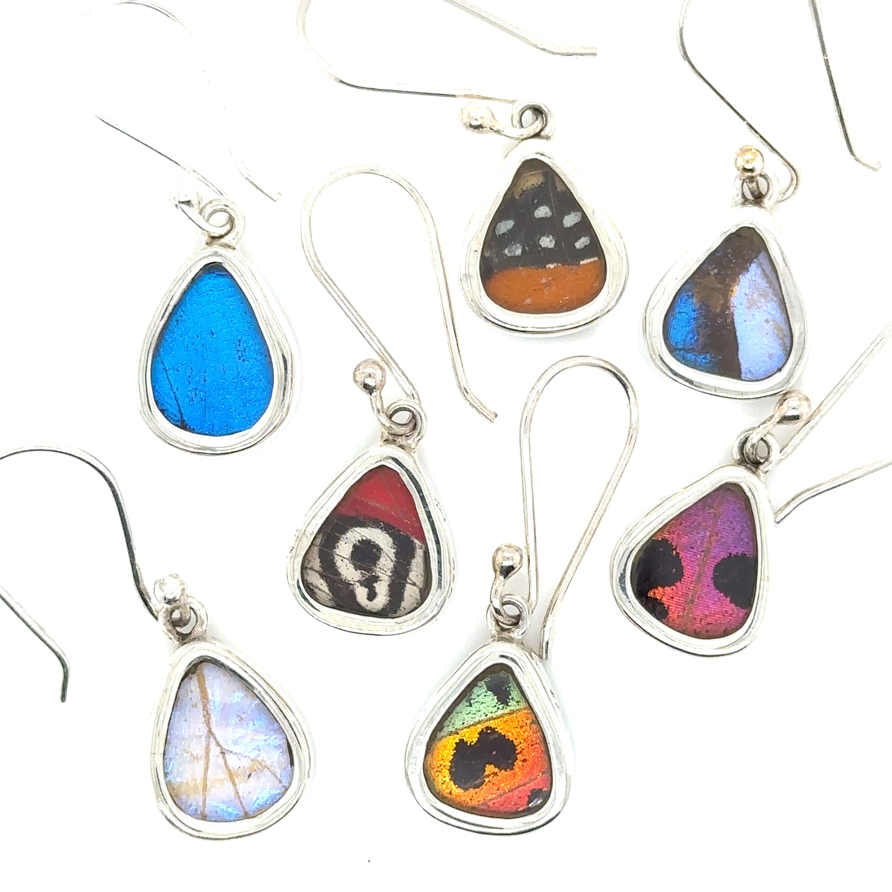 A group of Small Wide Teardrop Butterfly Wing Earrings on a white background, perfect for those who love boho style or sterling silver jewelry.