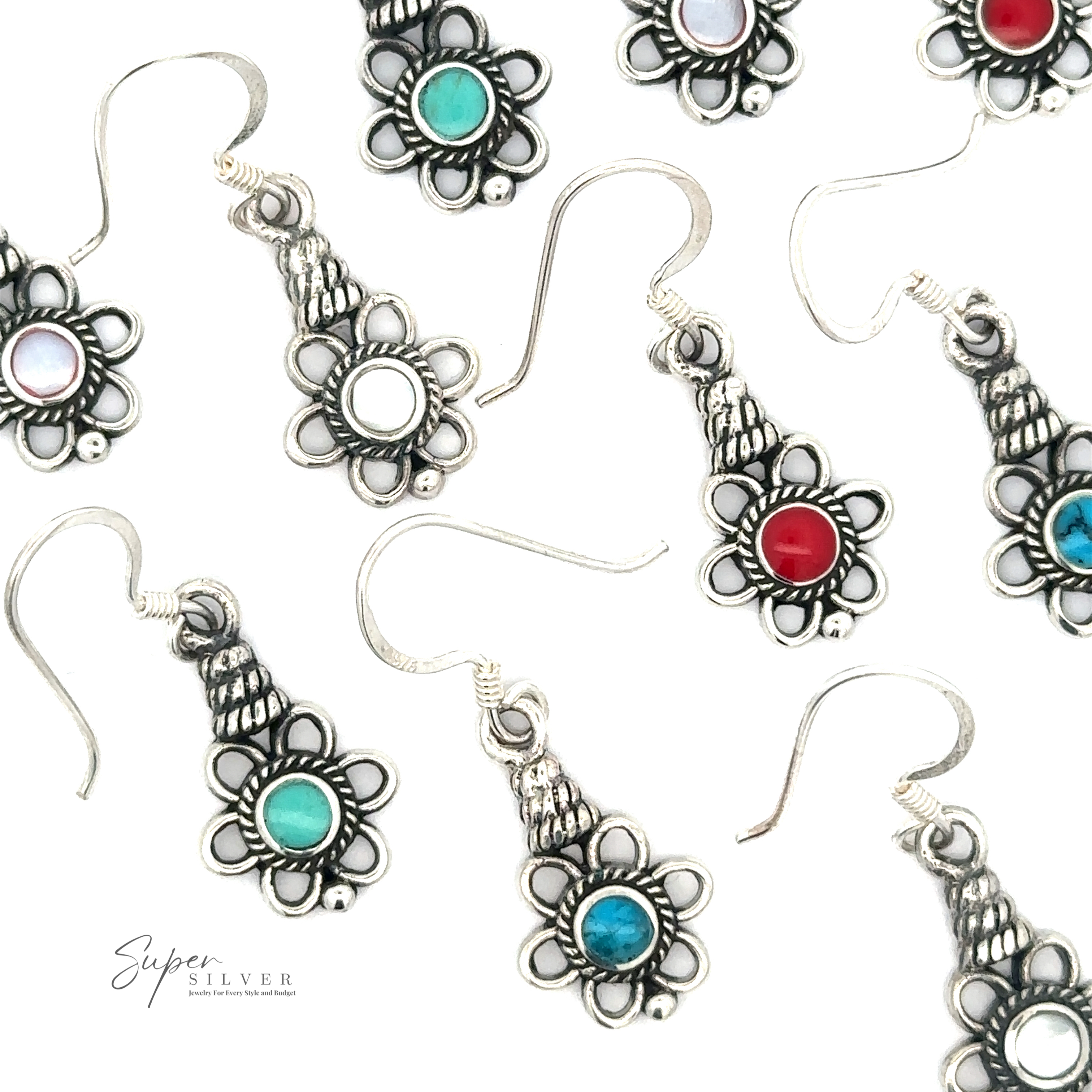 Close-up of Flower Design Earrings With a Round Stone in a flower shape with different colored round stones at the center, including red, turquoise, green, and white. Multiple pairs displayed against a plain background showcase six different stones.