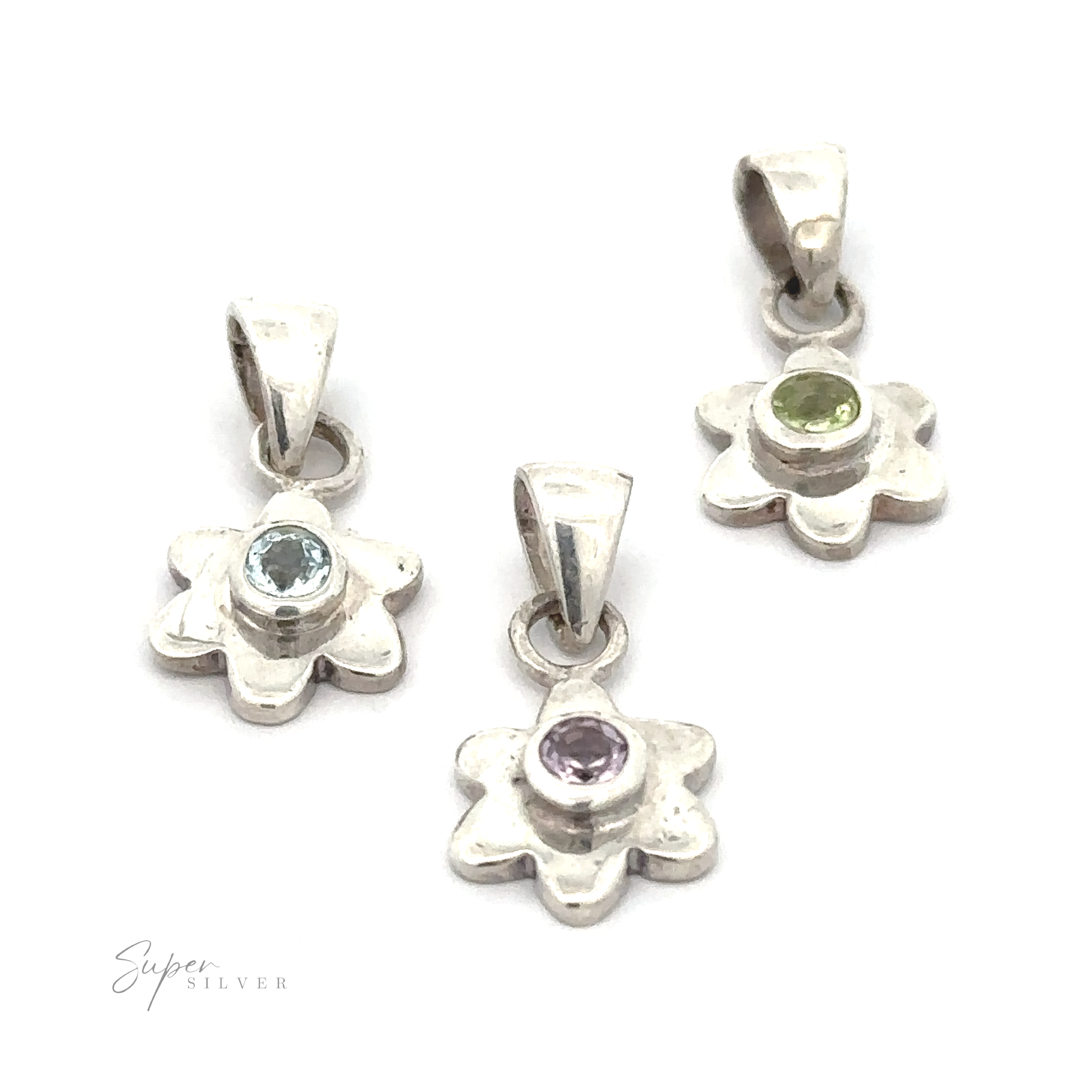 Three Tiny Gemstone Flower Pendants boast a gemstone center each: one with a light blue stone, one with a light green stone, and one with a light purple stone.