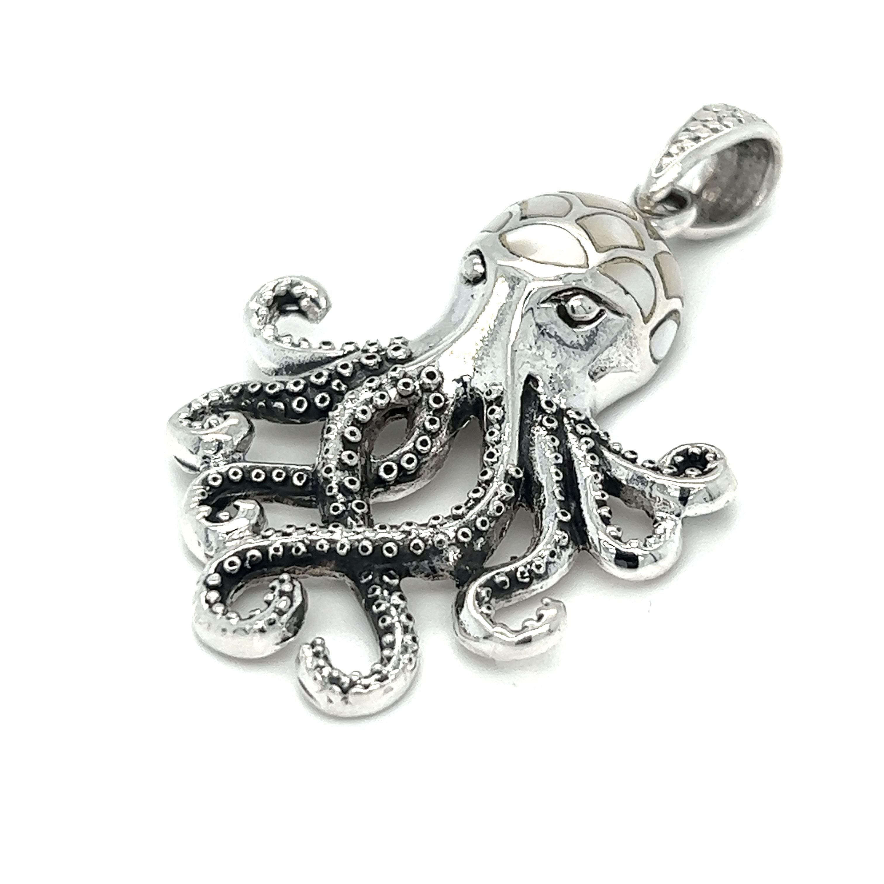A Super Silver Statement Octopus Pendant with Inlay Stones featuring inlay stone details on a white background.