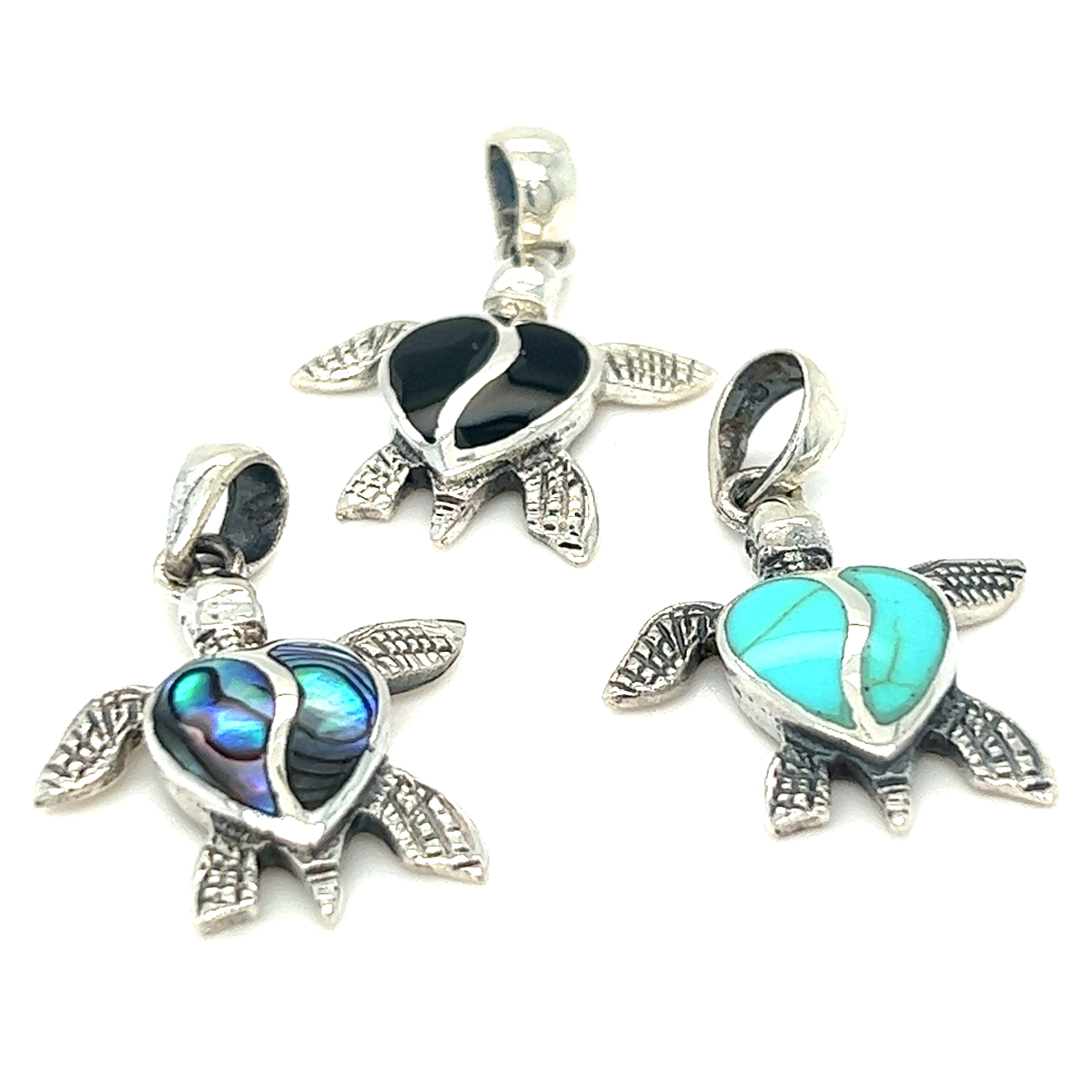 Three Stone Inlay Turtle Pendants adorned with turquoise stones.