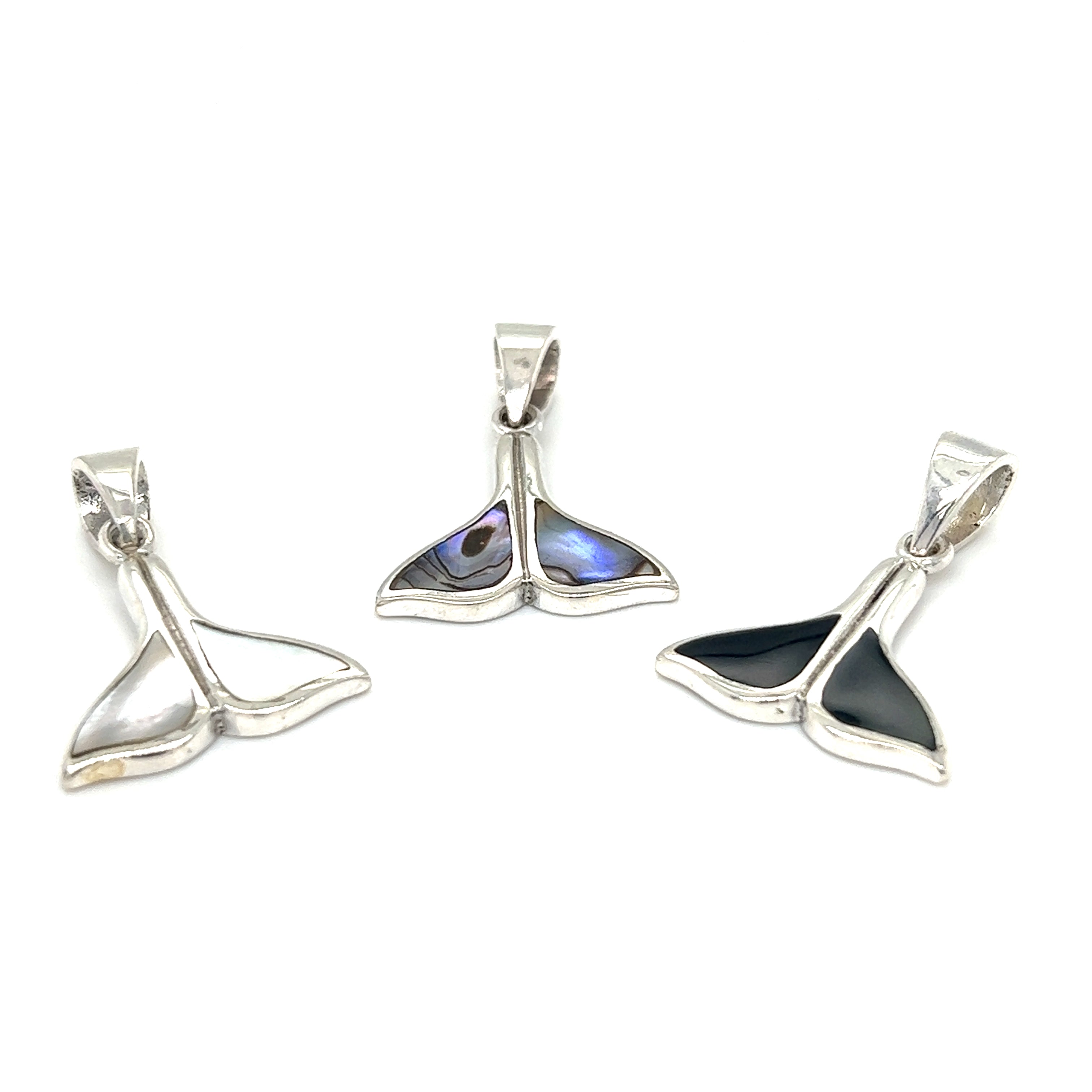 Three Simple Whale Tail Pendants with Inlay Stones by Super Silver on a white background.