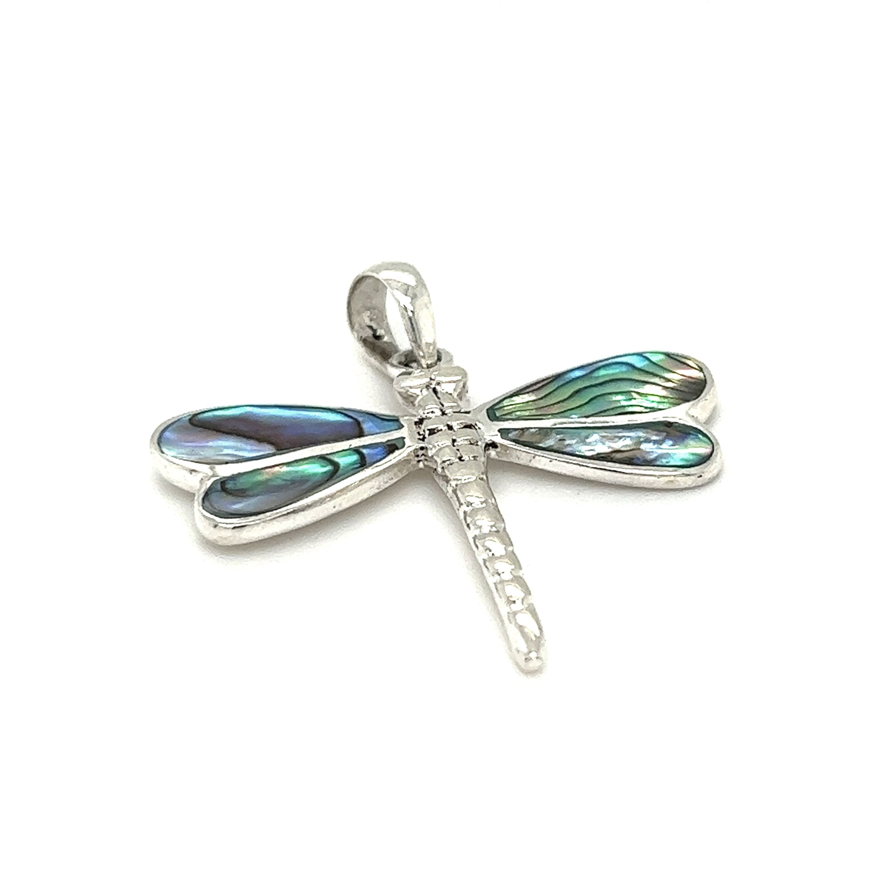 A Super Silver Dragonfly Inlay Stone pendant with subtle abalone accents on a white background.