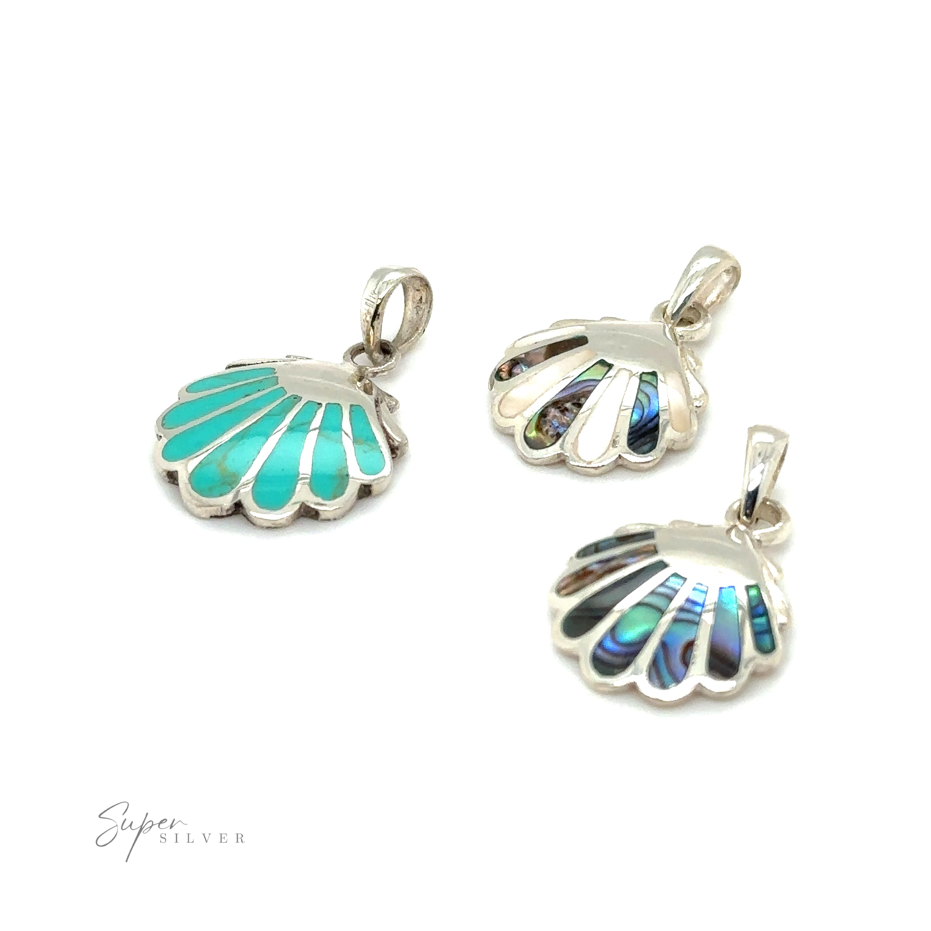 Three clam shell pendants in sterling silver featuring oceanic beauty with turquoise and abalone shells.