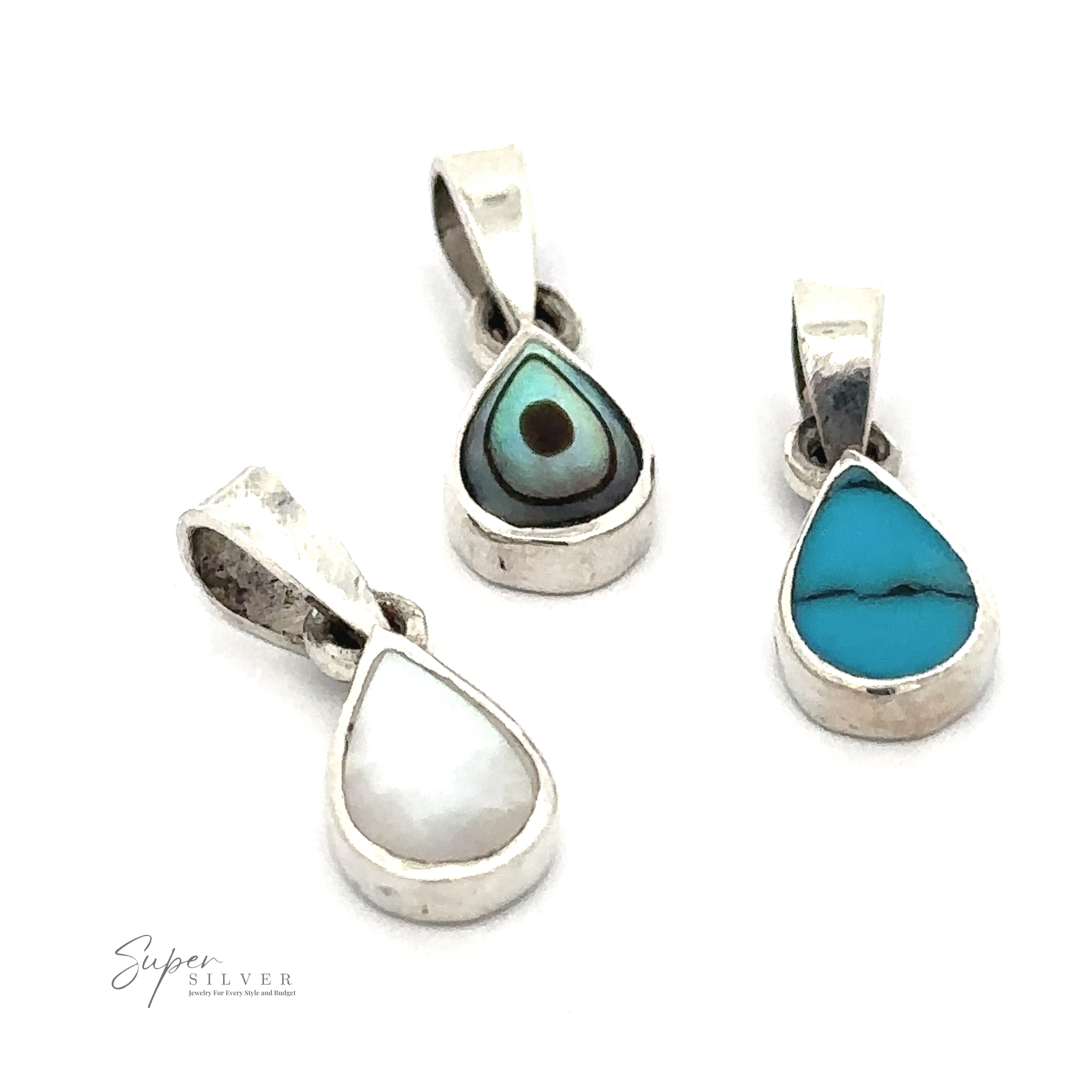 Three sterling silver pendants with teardrop-shaped turquoise, evil eye, and mother of pearl stones displayed on a white background. Perfect for those who appreciate minimal jewelry, each Tiny Inlay Teardrop Pendant adds a subtle touch of elegance.