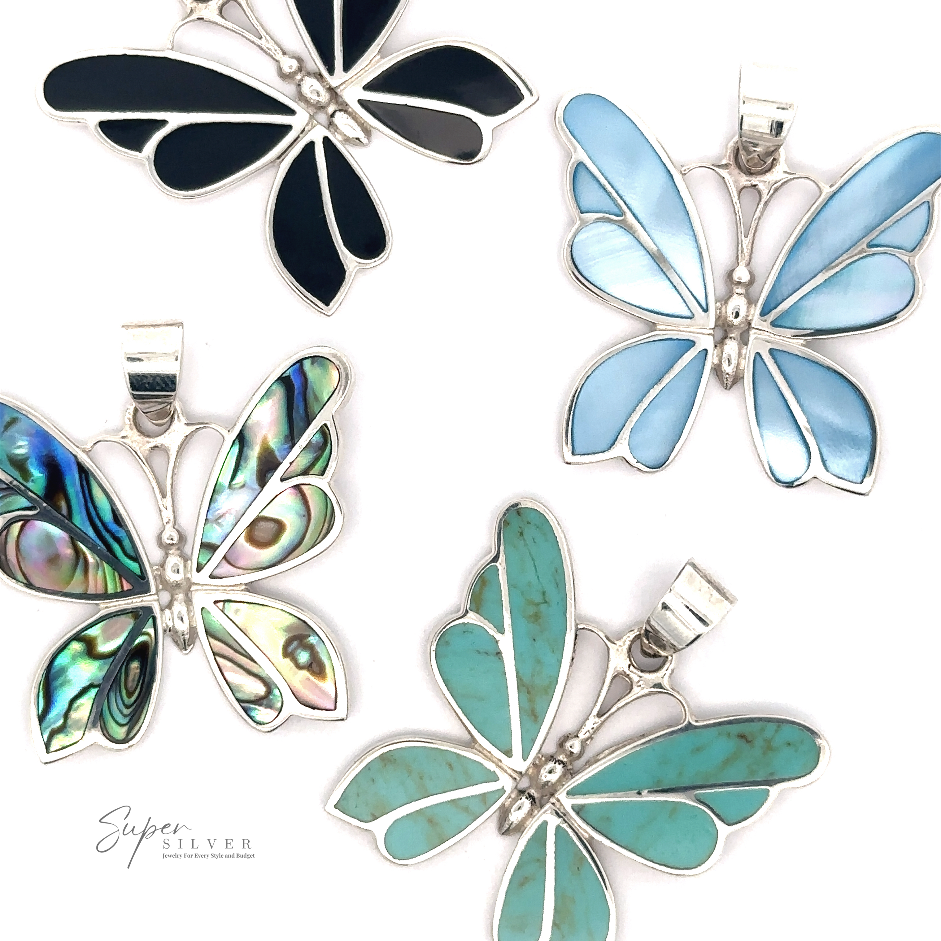 Four Medium Inlay Butterfly Pendants in silver frames, decorated with various colorful inlays including blue, green, and iridescent patterns, arranged on a white background. The "Super Silver" logo sits elegantly in the corner.