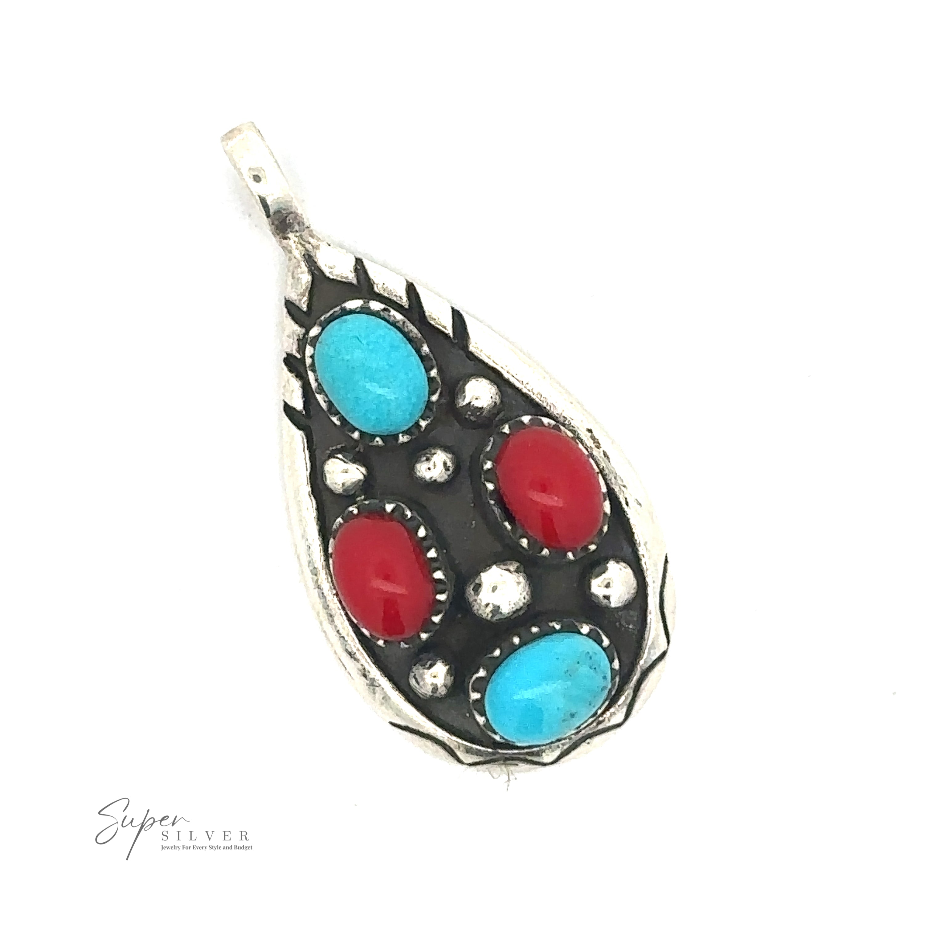 Silver pendant with teardrop shape featuring alternating turquoise and coral stones surrounded by intricate metalwork. Text at the bottom reads "Super Silver." This Teardrop Turquoise and Coral Pendant embodies both elegance and cultural charm.