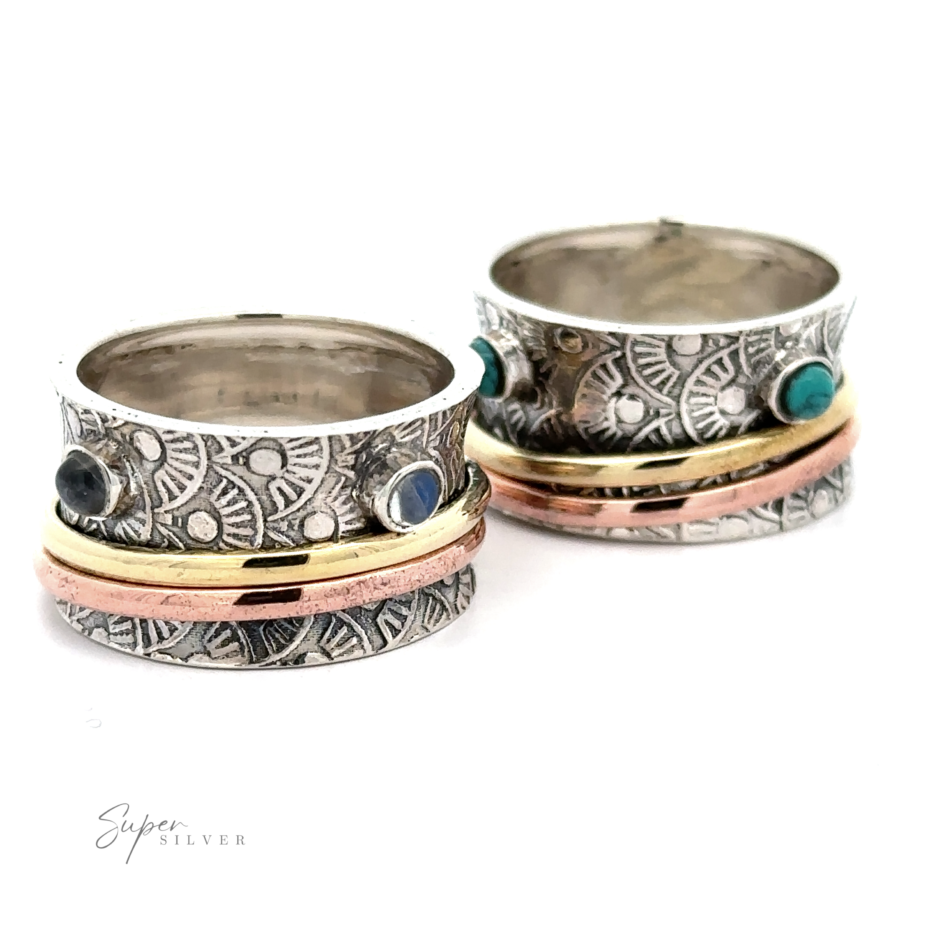 A close up of the Handmade Tricolor Spinner Ring with Moonstone Accents featuring moonstones.