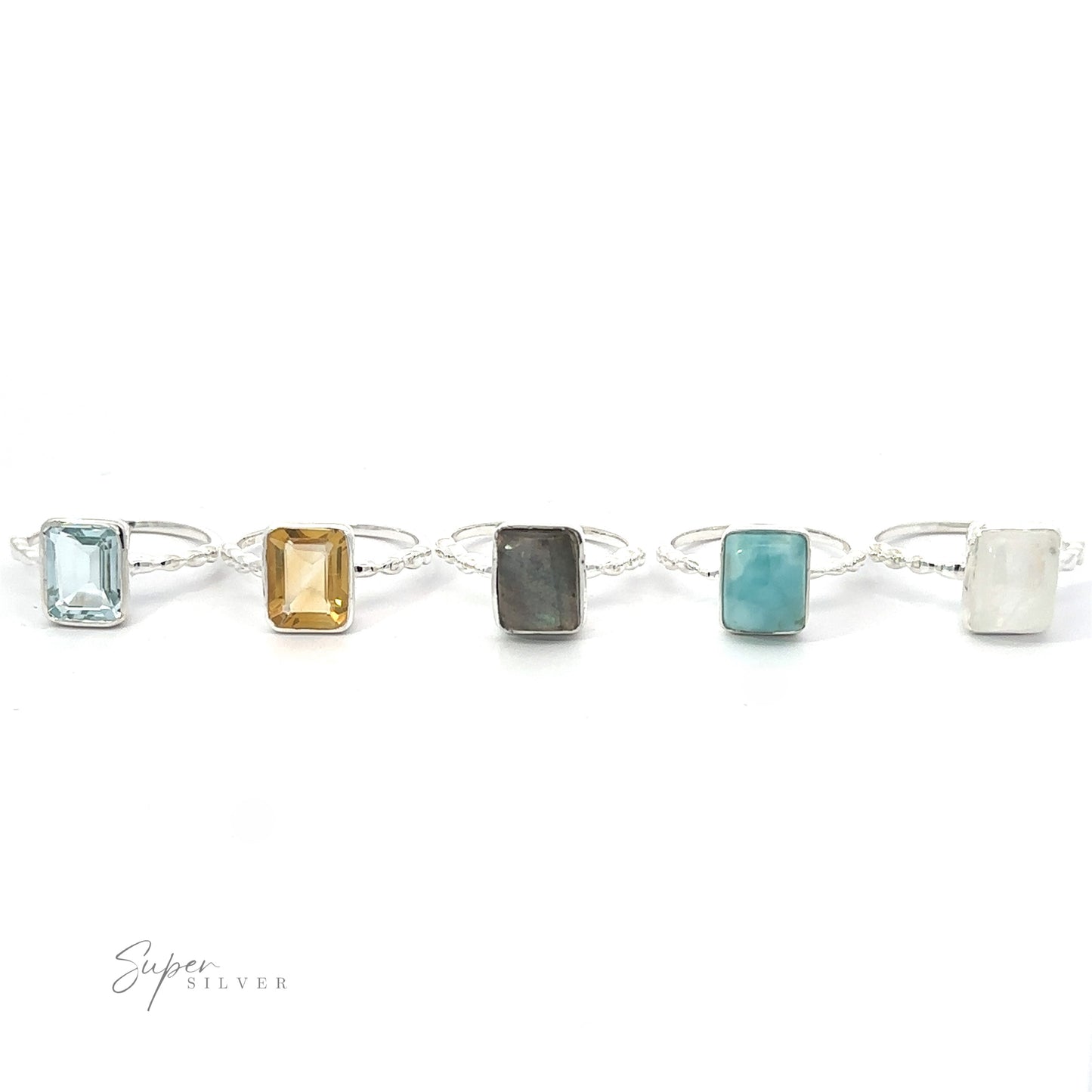 Five Rectangle Gemstone Rings with Beaded Bands in a row against a white background.
