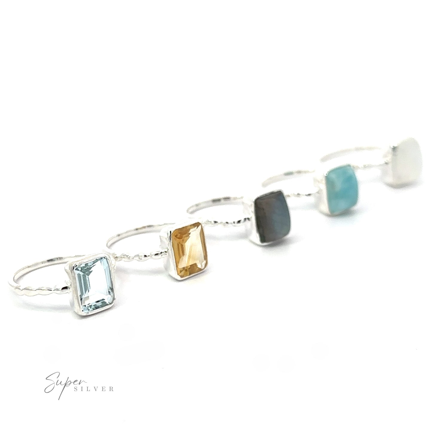 A collection of Rectangle Gemstone rings with Beaded Bands displayed against a white background.