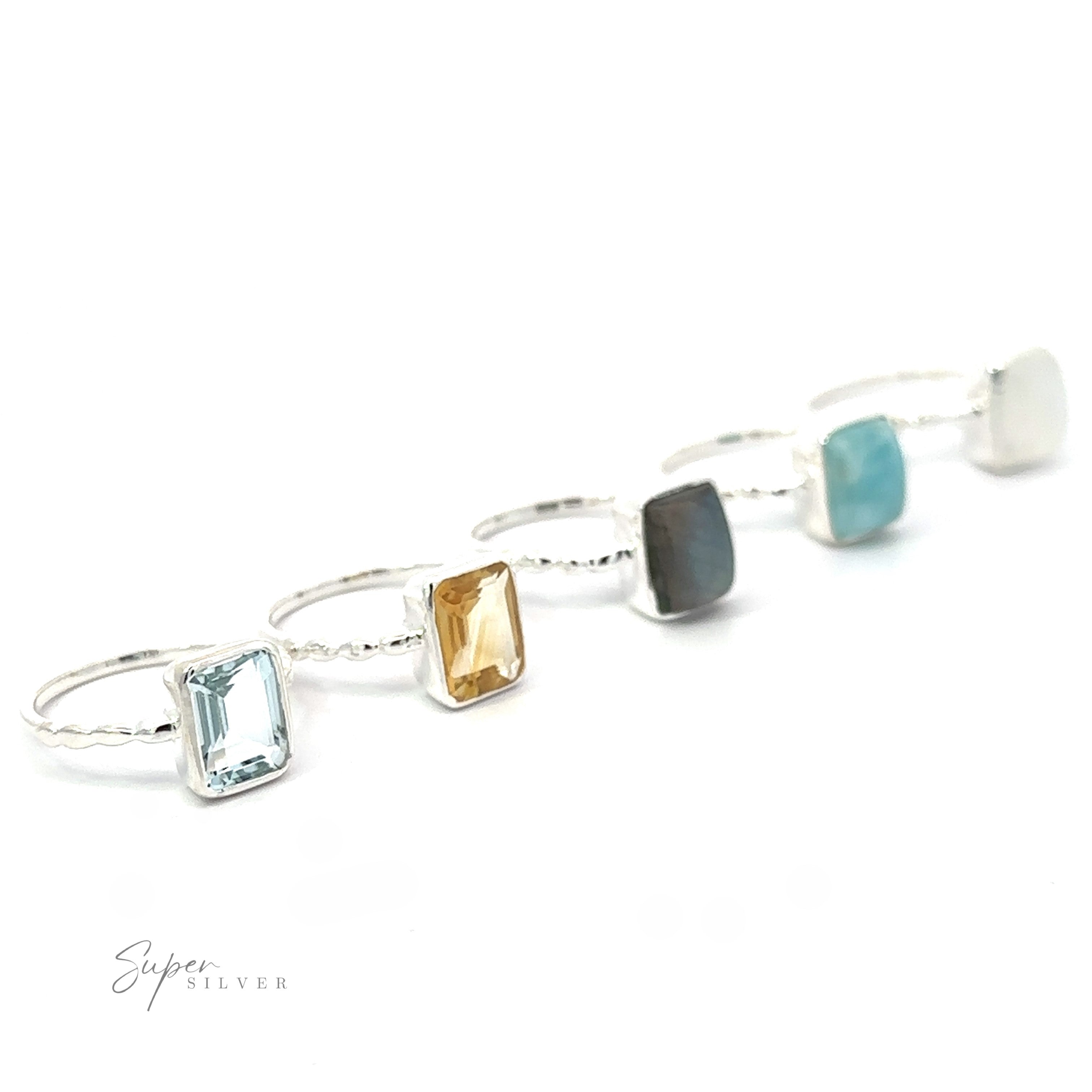 Four Rectangle Gemstone Rings with Beaded Bands in .925 Sterling Silver displayed in a row against a white background.
