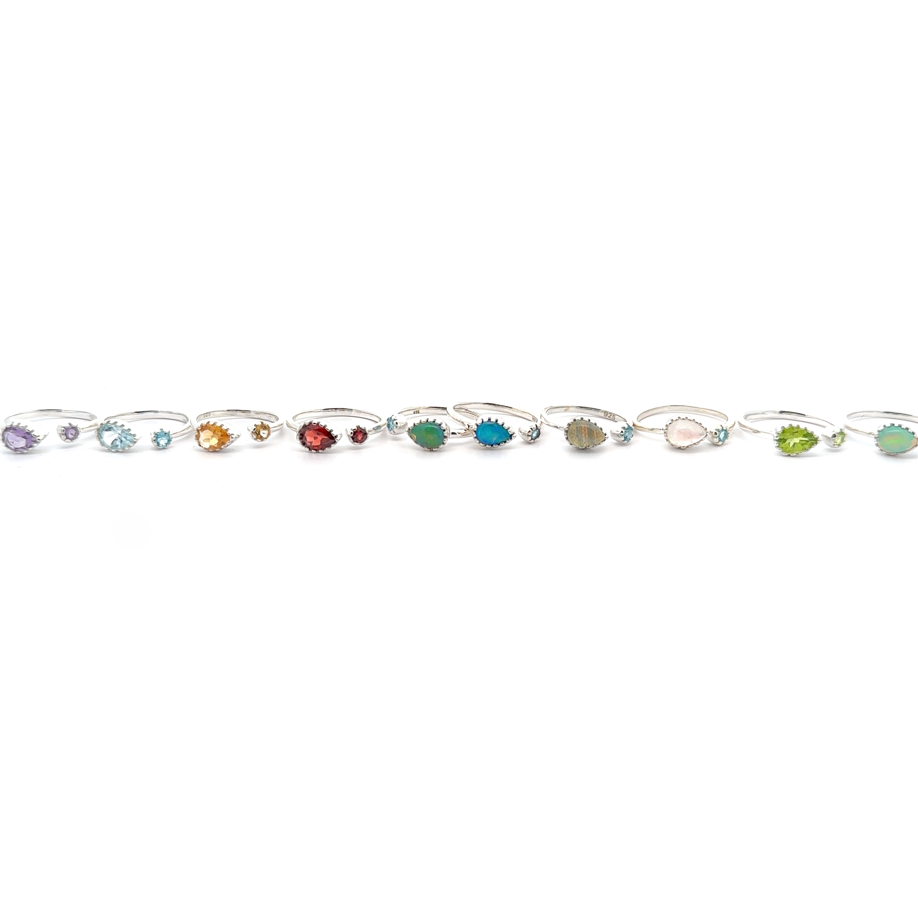 A Dainty Adjustable Gemstone Ring with Two Stones in various colors set in a sterling silver chain, displayed against a white background.