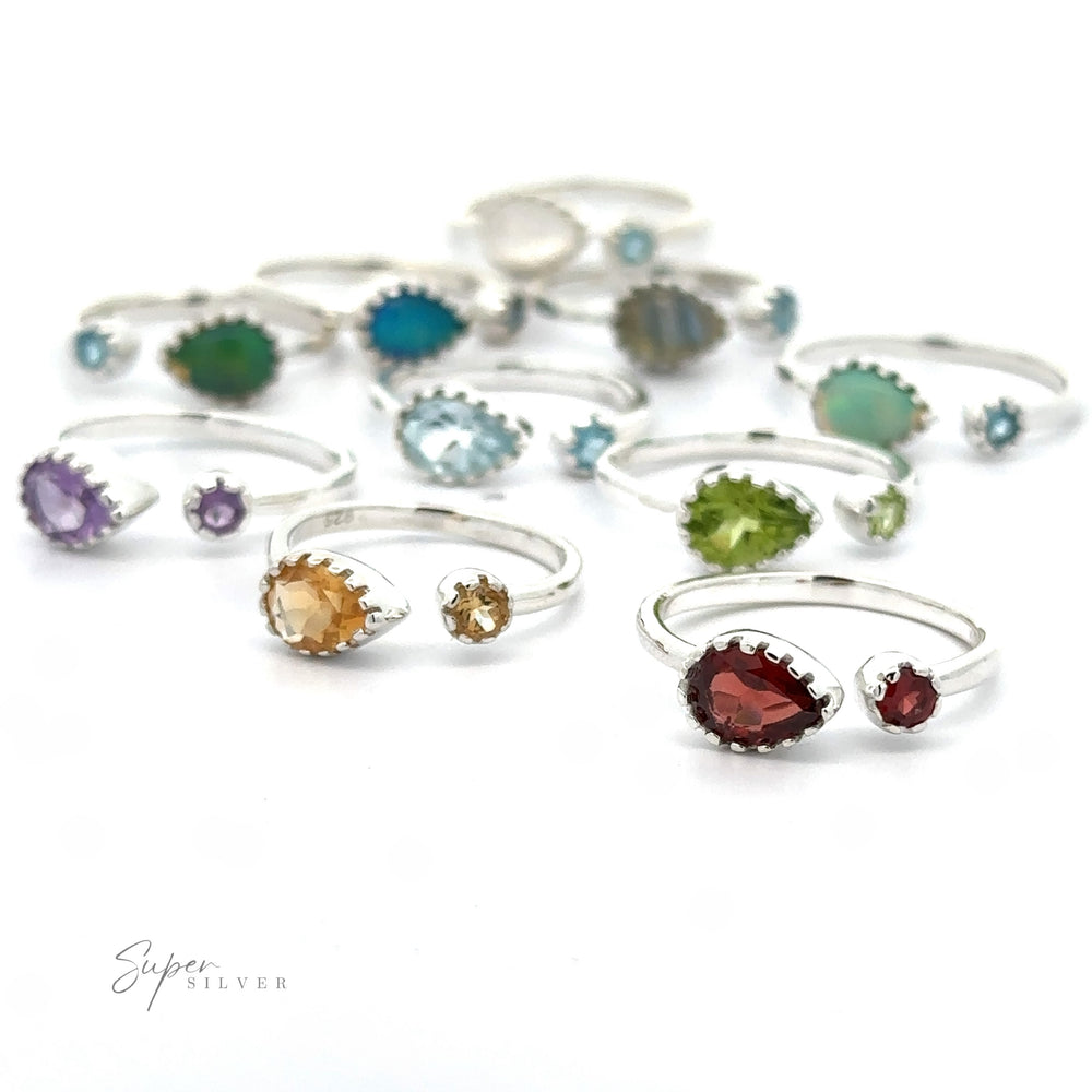 
                  
                    A collection of Dainty Adjustable Gemstone Rings with Two Stones displayed against a white background.
                  
                