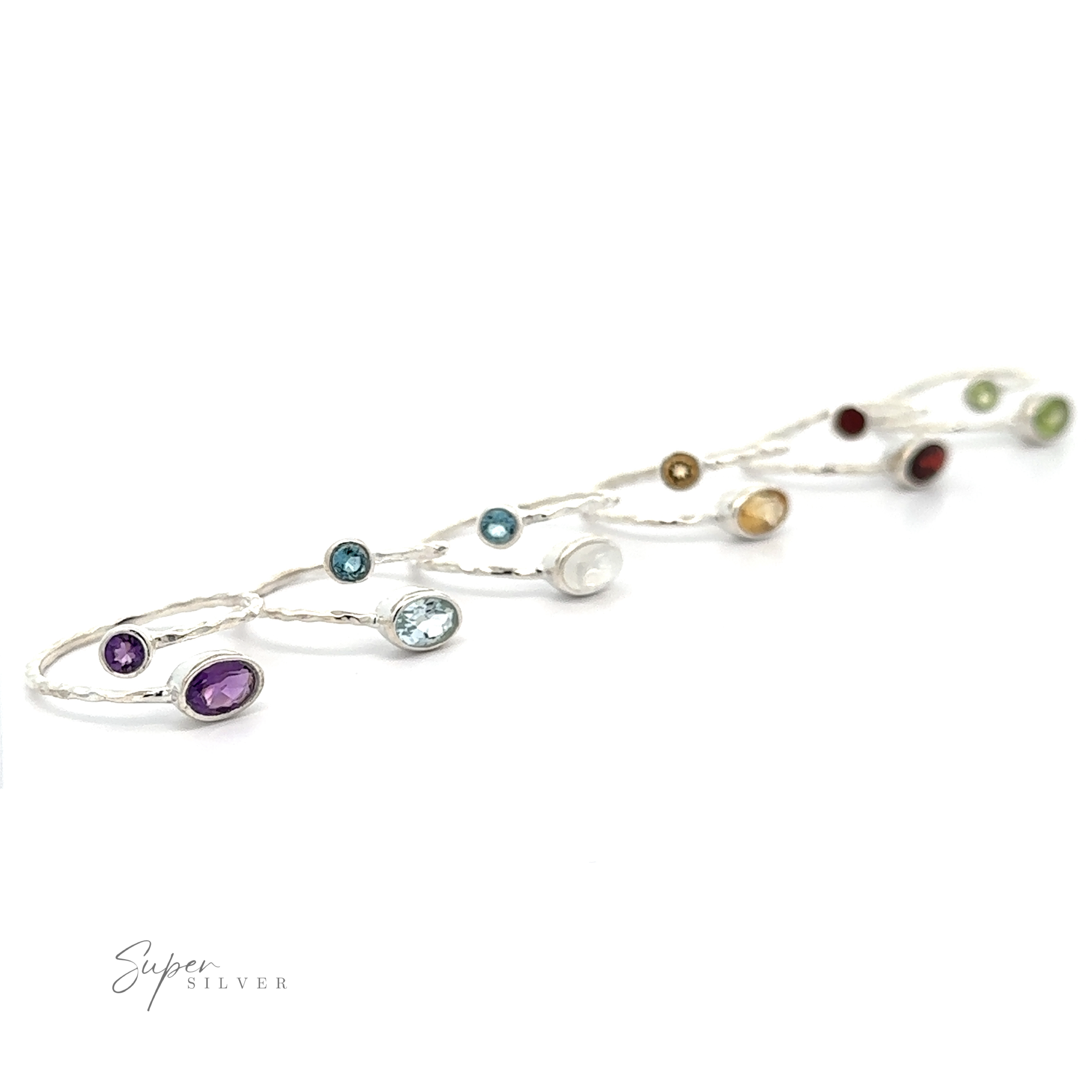 A Textured Adjustable Band with Adorned Gemstones bracelet with multicolored gemstones on a white background, serving as a statement piece.