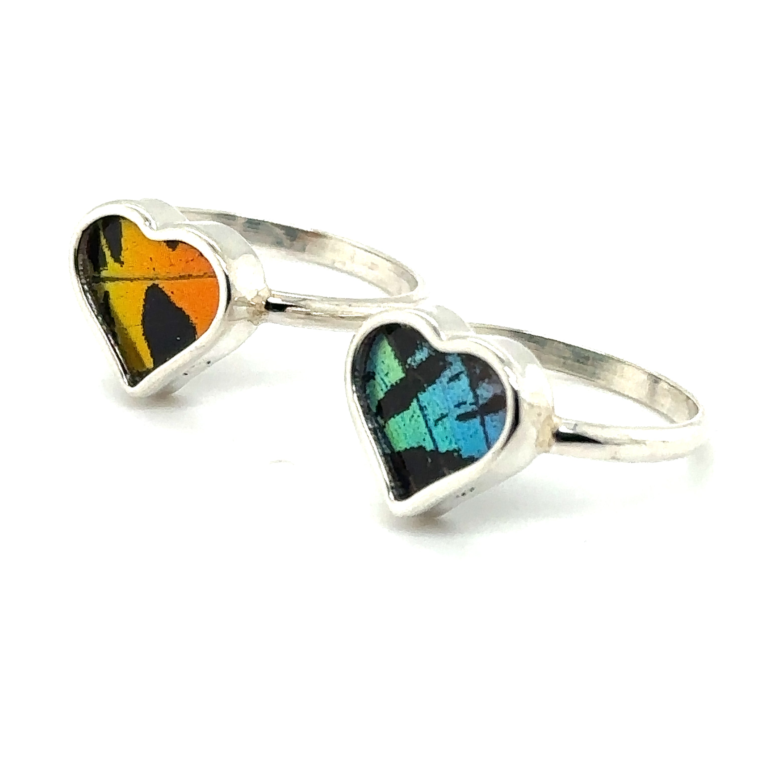 Two Genuine Butterfly Rings in Heart Shape from Santa Cruz, making a statement.