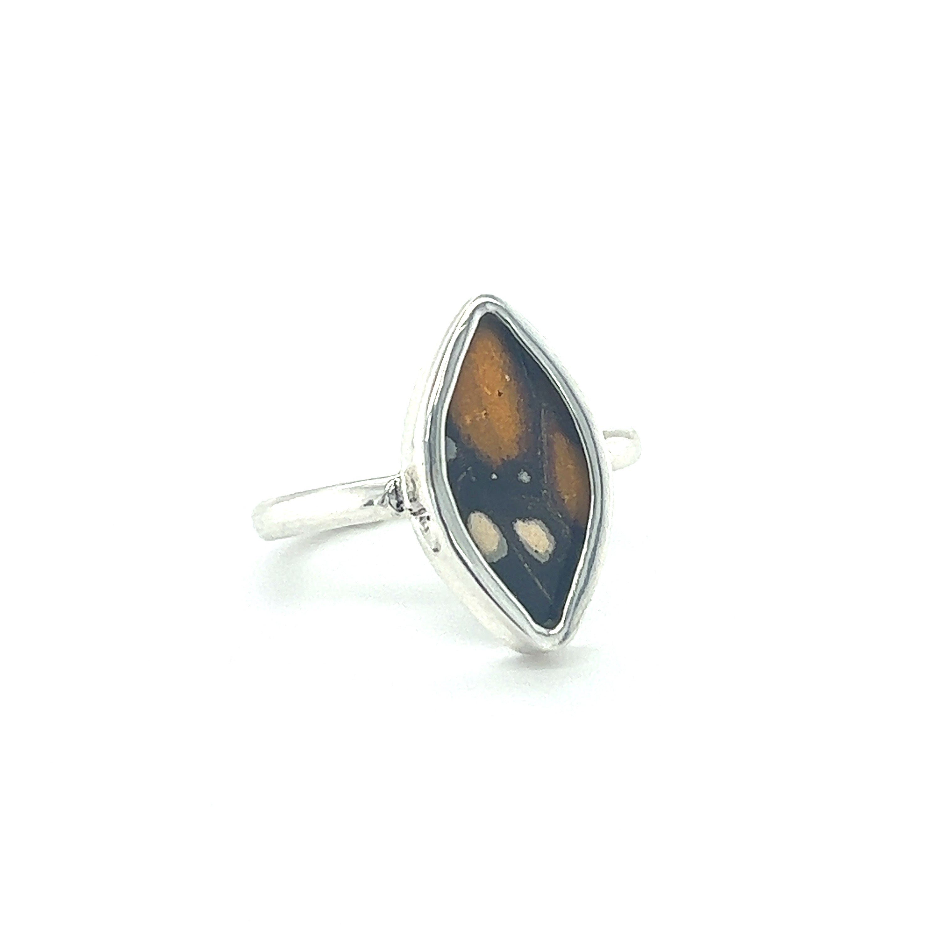 A sustainable fashion Genuine Butterfly Wing ring in Marquise Shape with a black and brown stone.