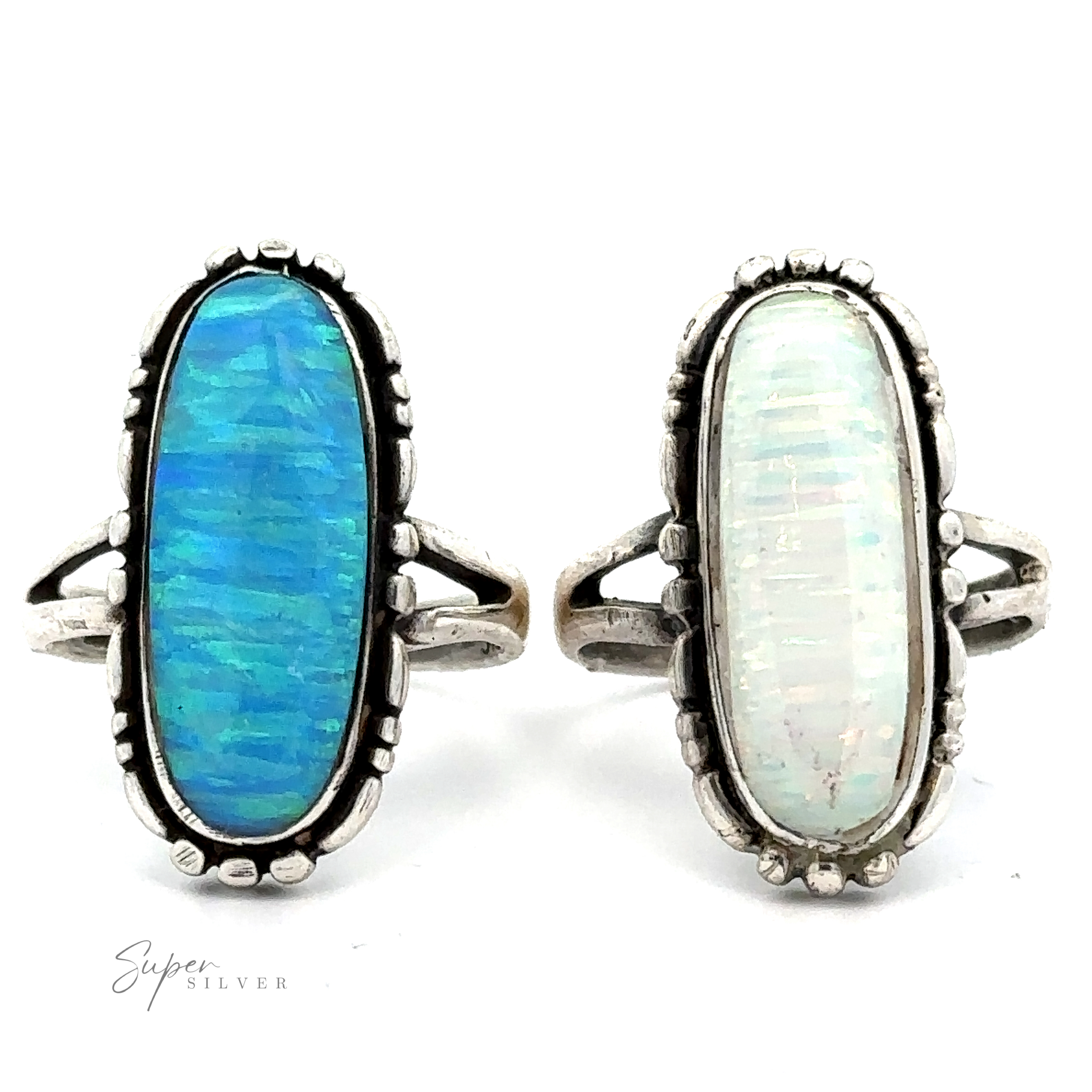 The American Made Oval Opal Ring, each featuring an elongated oval gemstone—one blue and one white—adorn simple bands. The Southwestern-styled elegance is enhanced by lab-created opal accents.