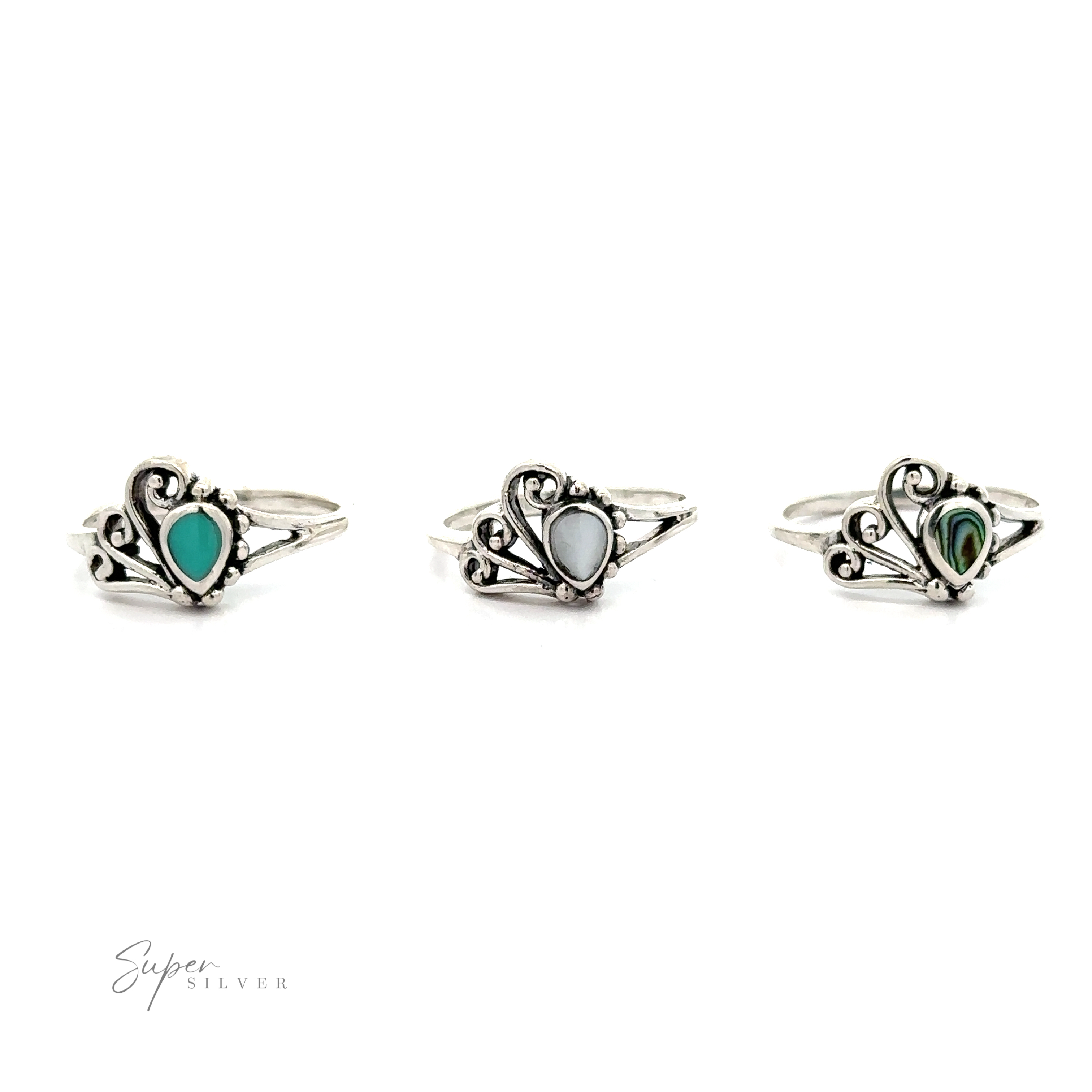 Three silver Inlaid Stone Rings with Freeform Design on a white background.