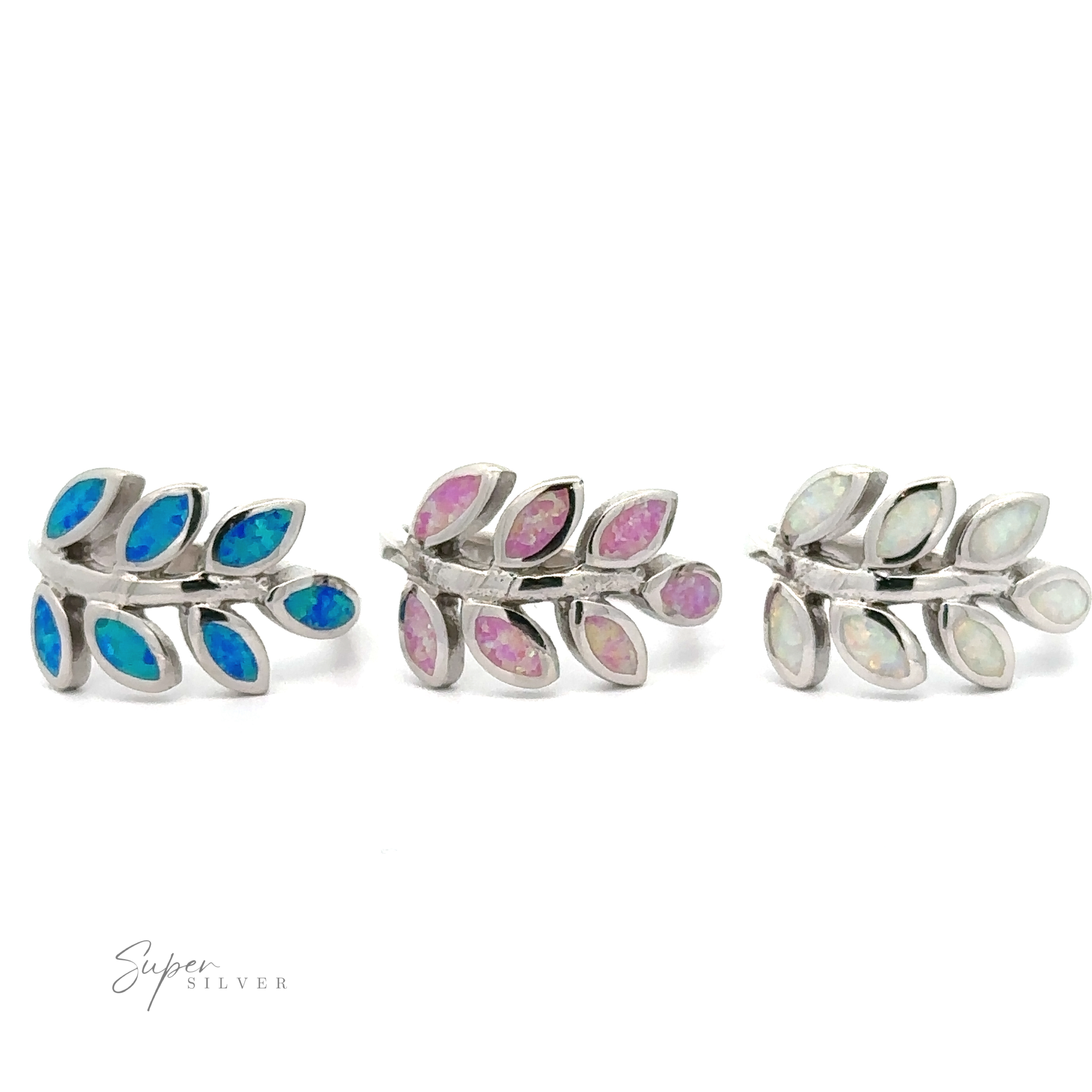 Three pairs of fern leaf-shaped sterling silver earrings with different colored lab-created opals on a white background.