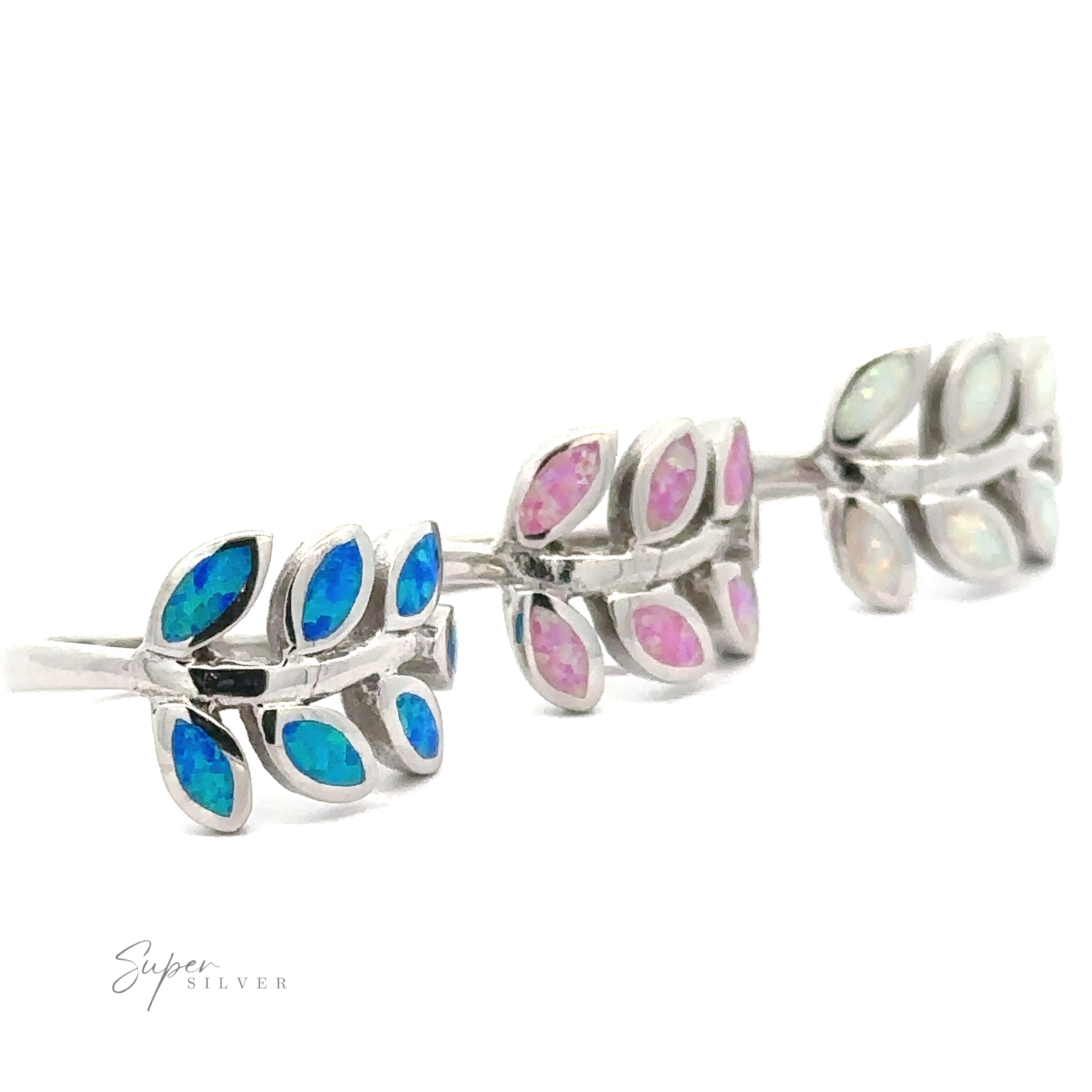 Two pairs of leaf-shaped sterling silver earrings with blue and pink Lab-Created Opal Fern Ring inlays on a white background.