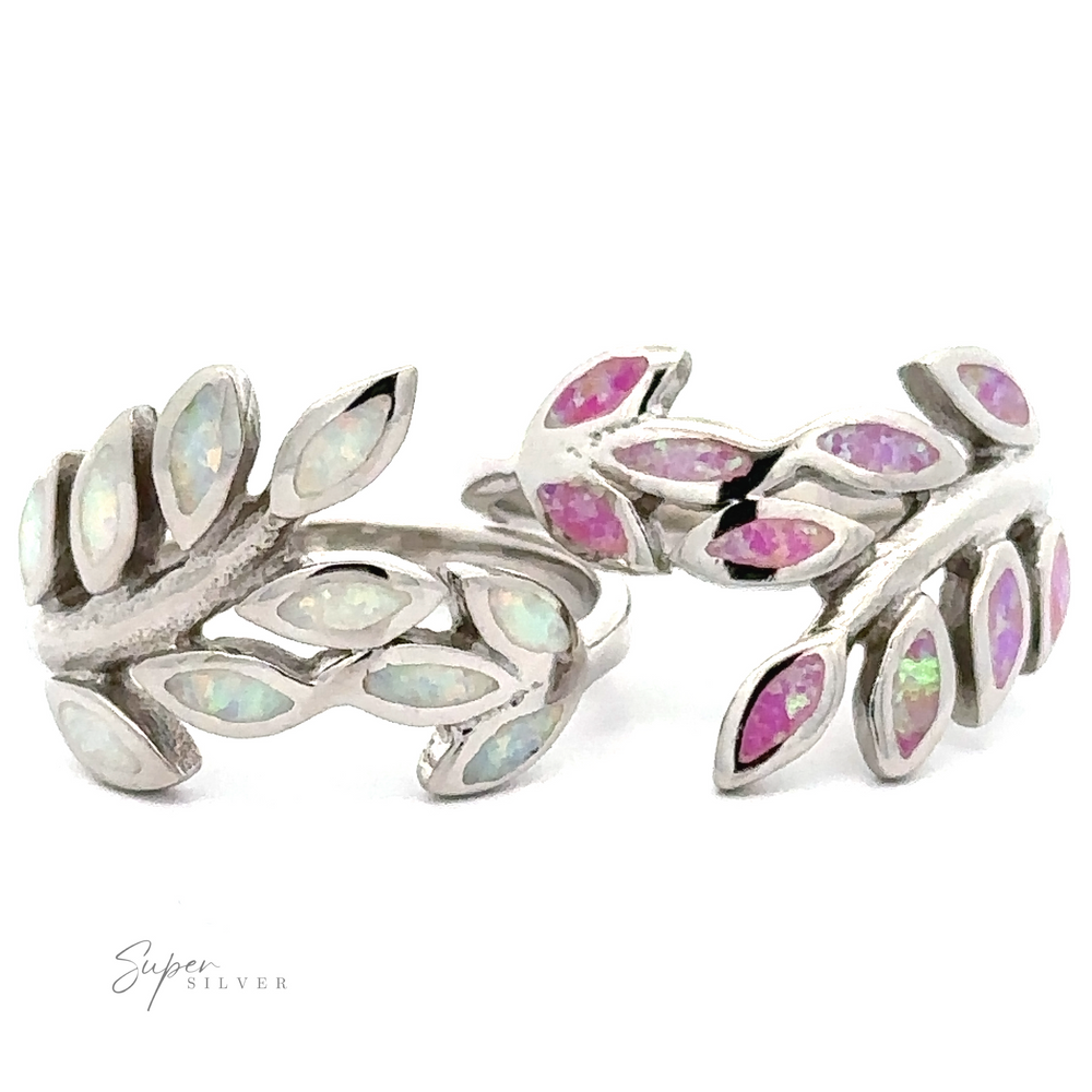 Sterling silver cuff bracelets featuring fern branches designs inlaid with pink and white Lab-Created Opal Fern Motif Ring stones.