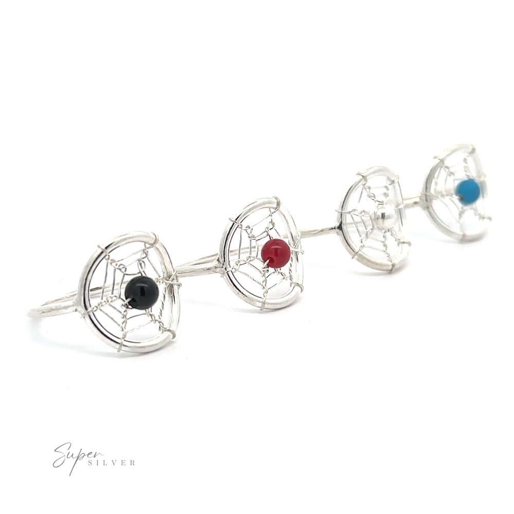 Four Wire Dreamcatcher Rings with Bead earrings with a globe design, each featuring a different colored gemstone at the center, displayed on a white background.