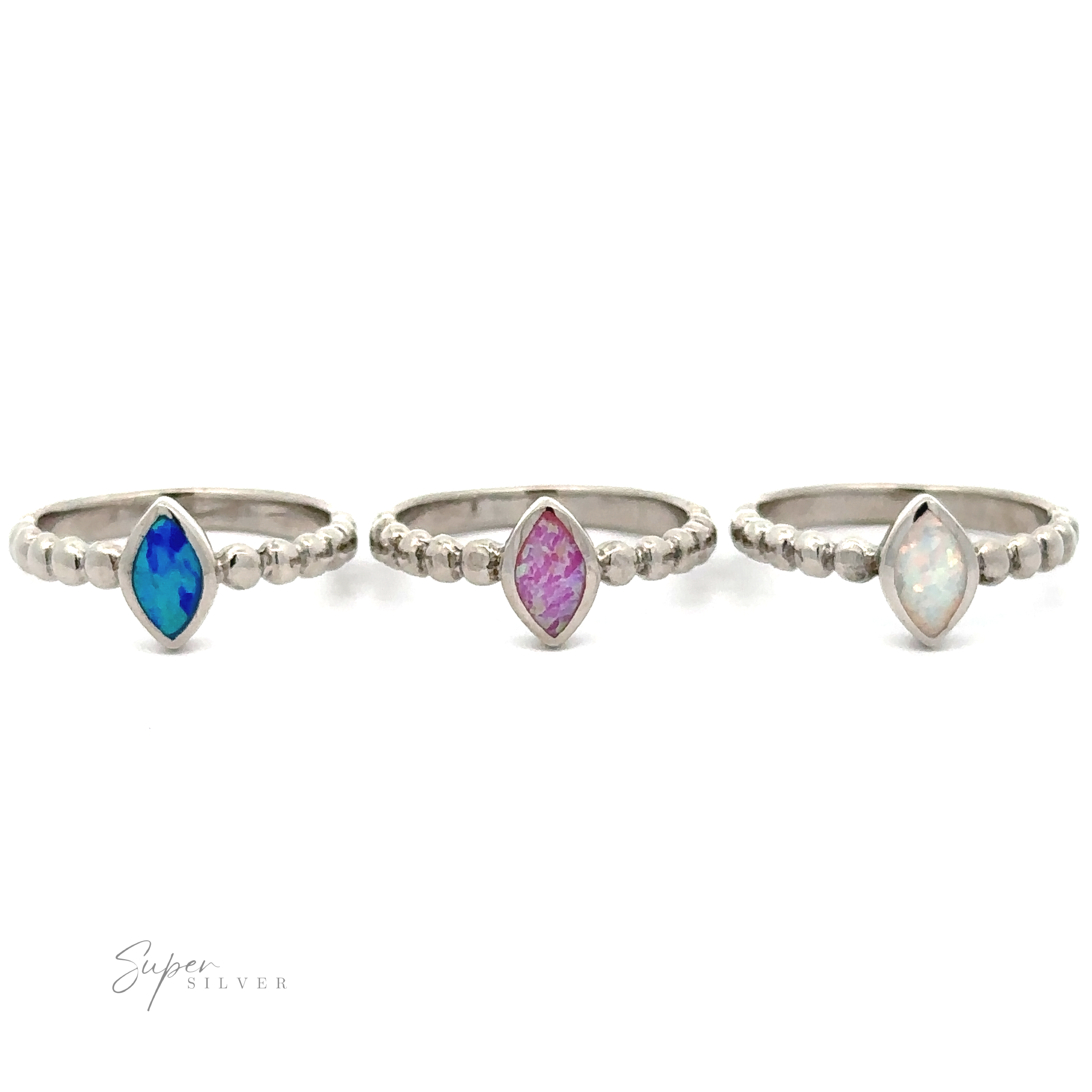 Three silver rings with gemstones: a Marquise Lab-Created Opal ring with a blue stone, another with a pink stone, and a third with an opalescent stone, displayed against a white background.