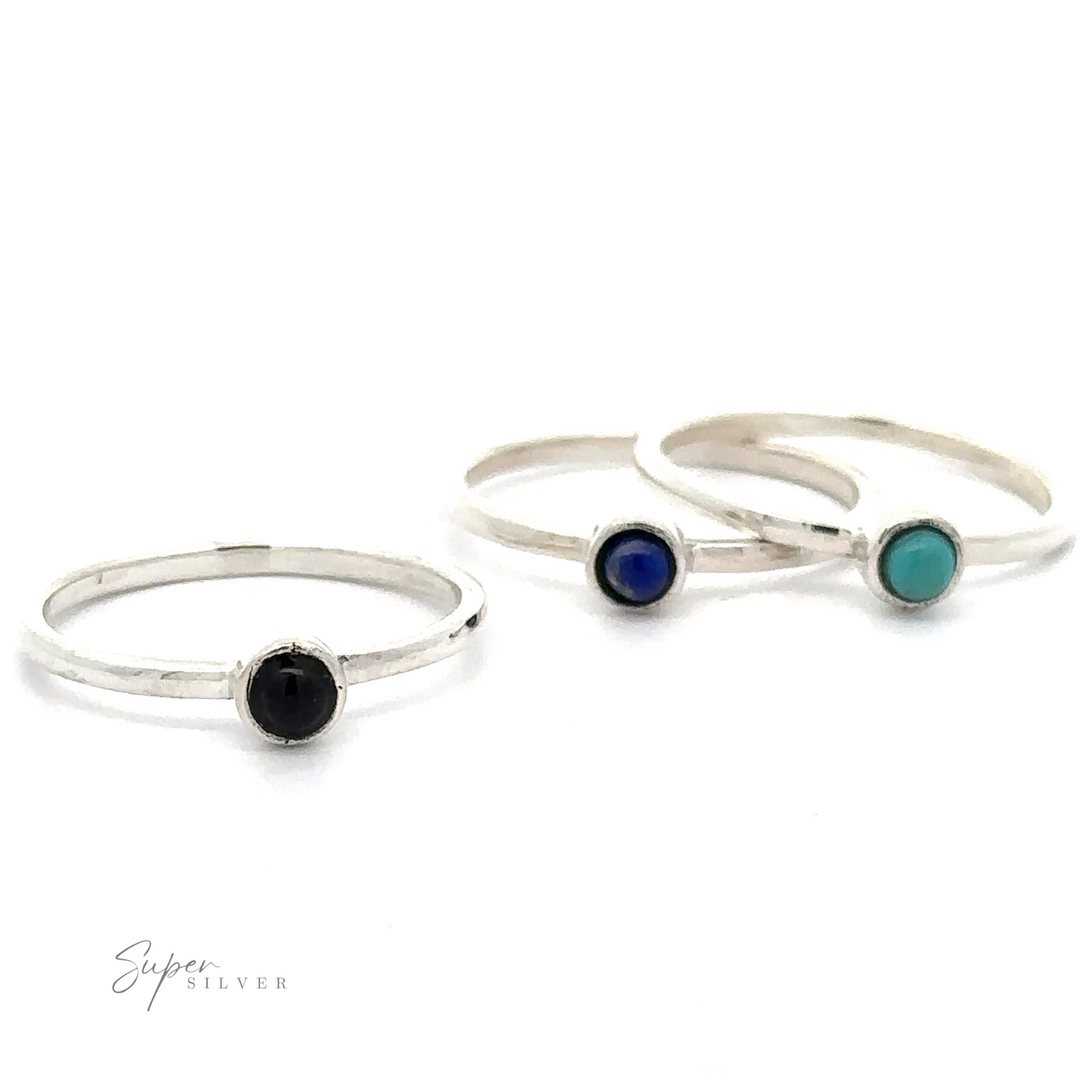 Three sterling silver rings, each with a circular stone—one black, one blue, one turquoise—are arranged in a diagonal line against a white background. "Dainty Stackable Round Gemstone Ring" text is visible in the bottom-left corner. Perfect for fans of minimalist fashion, these stackable rings add subtle elegance to any outfit.