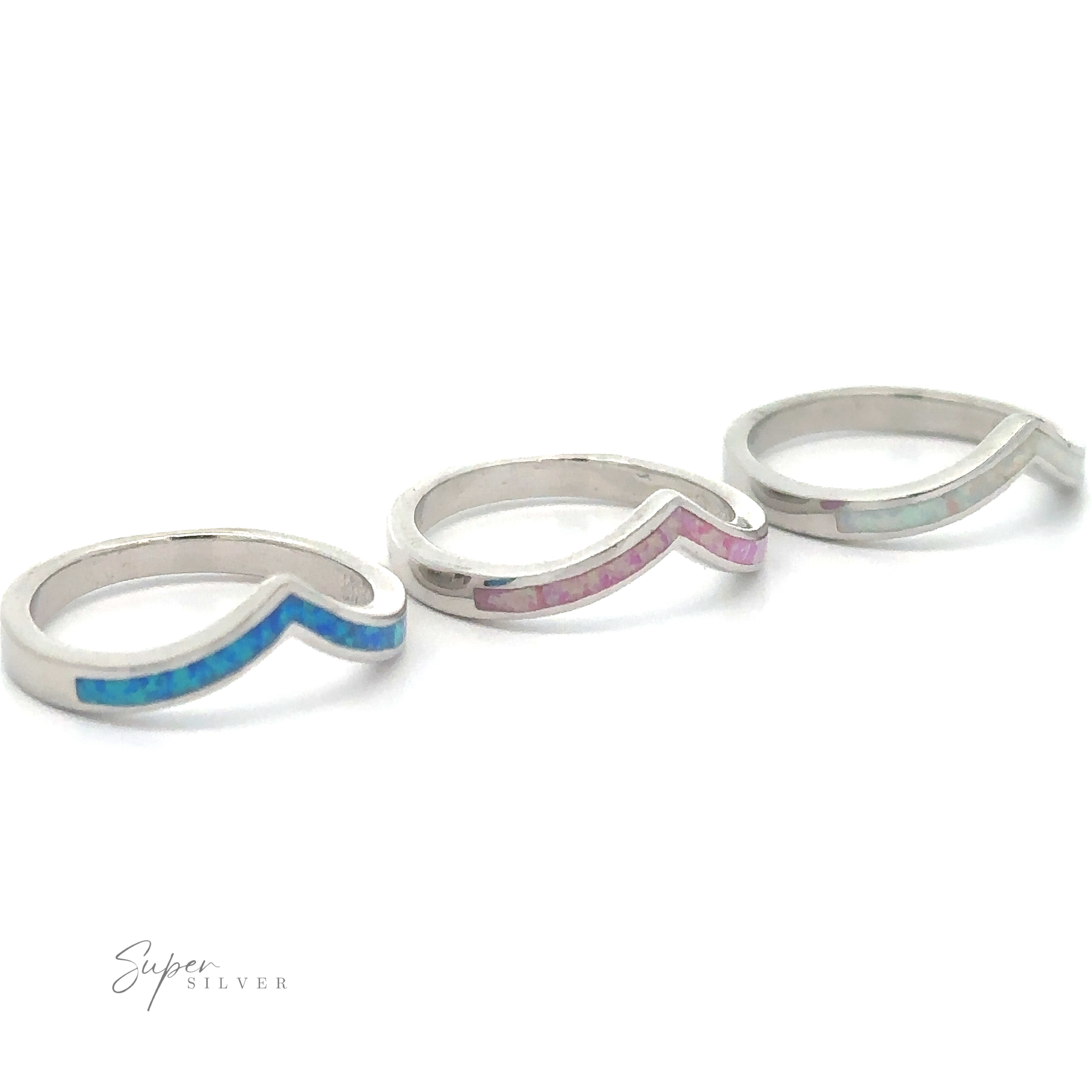 Three Elegant Chevron Lab Opal Rings, ideal for stacking, on a white background.