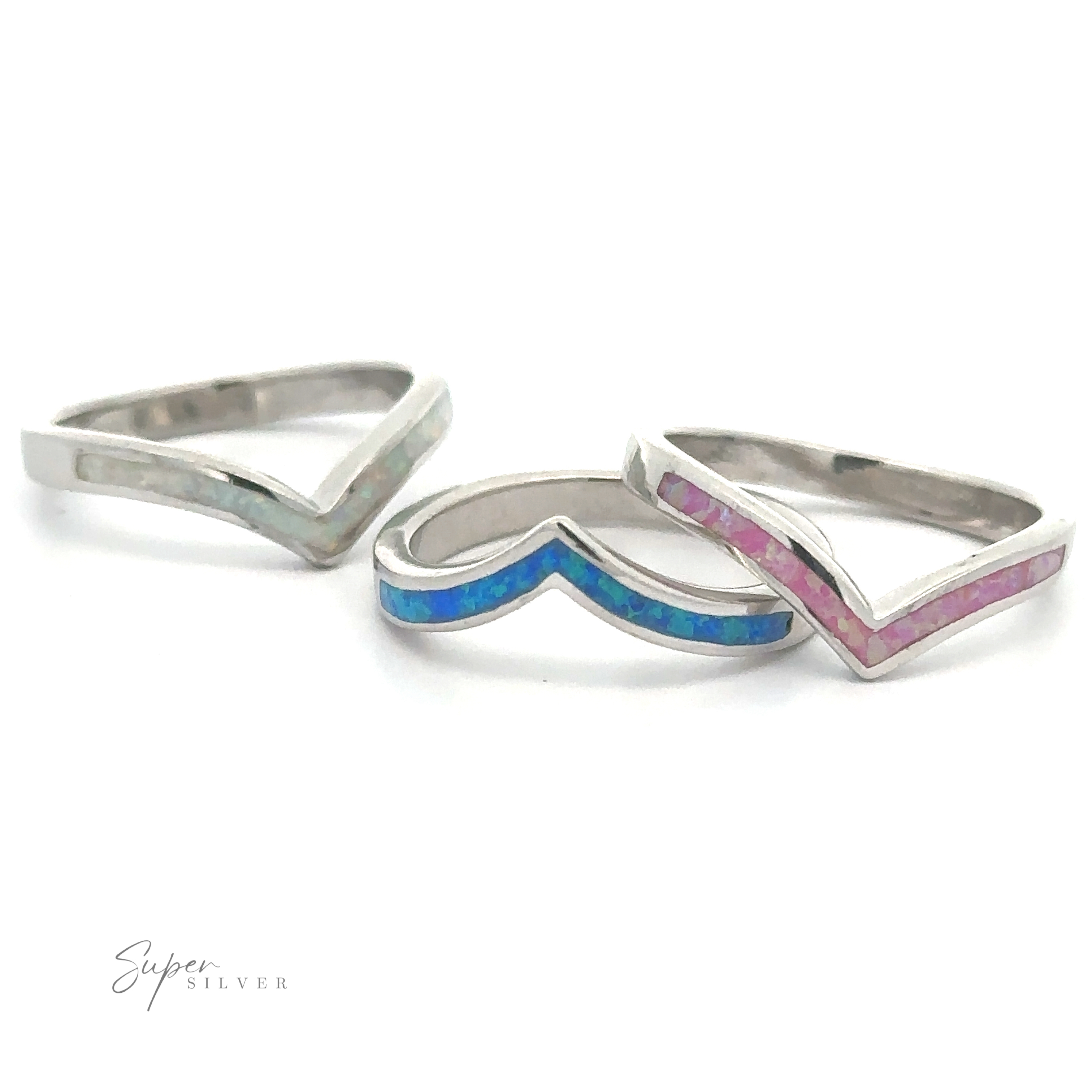 Three Elegant Chevron Lab Opal Rings with inlaid colorful details on a white background.