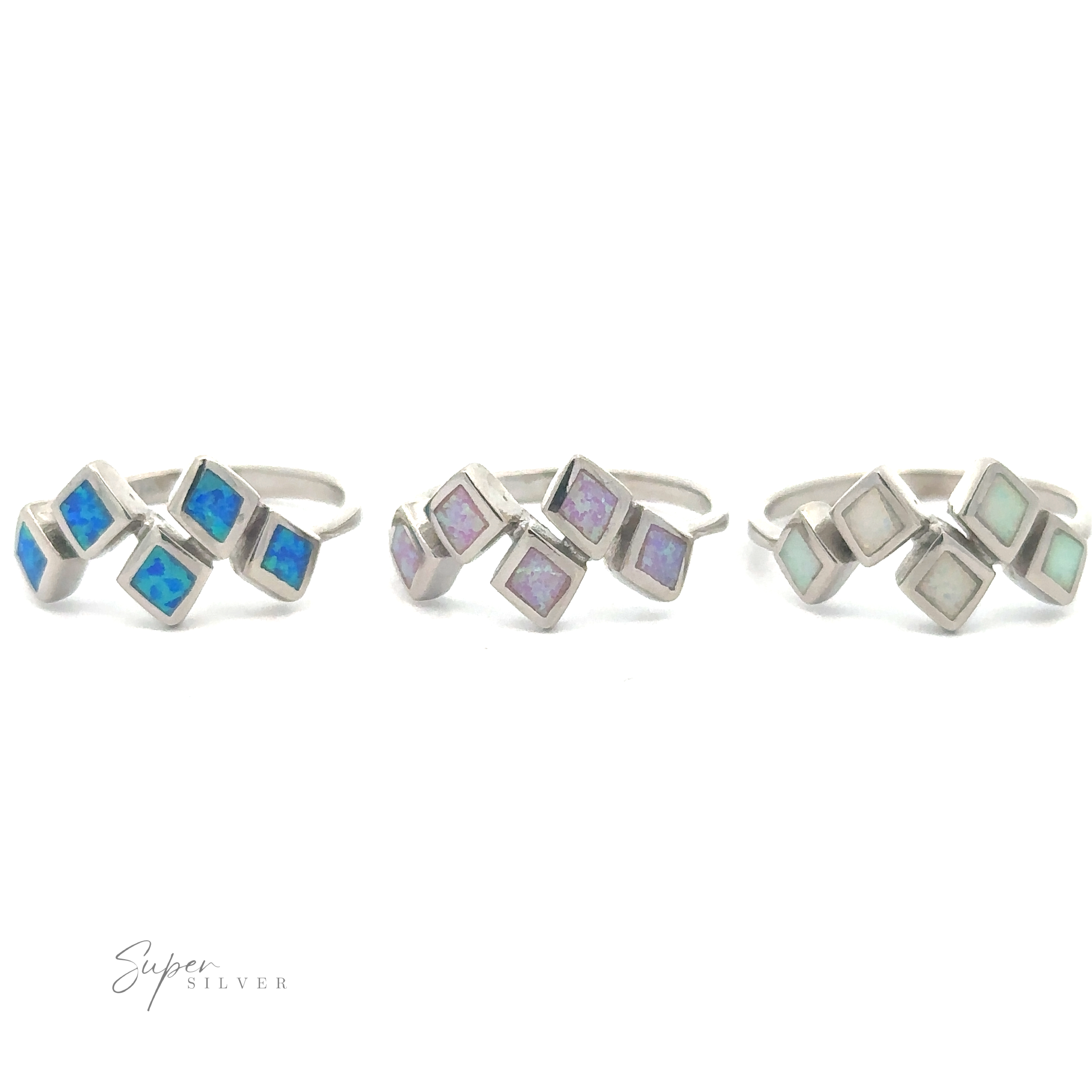Three Diamond Pattern Lab-Created Opal rings with geometric inlays of lab-created opal in blue, purple, and green displayed on a white background.