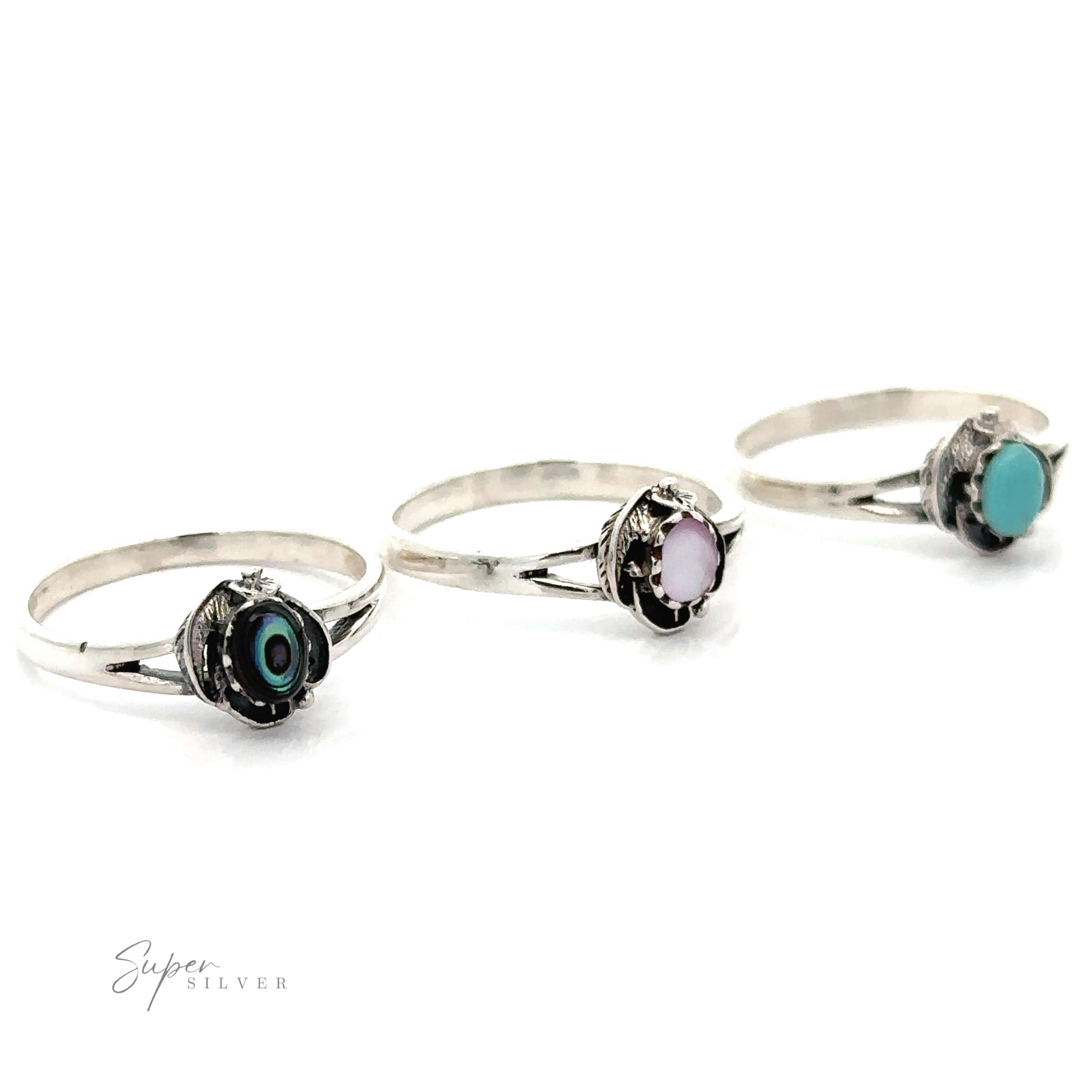 The "Inlay Stone Ring With Delicate Detailing" collection features three sterling silver rings with Southwest flair, showcasing timeless elegance with black, pink, and turquoise stones in a round setting on simple bands.