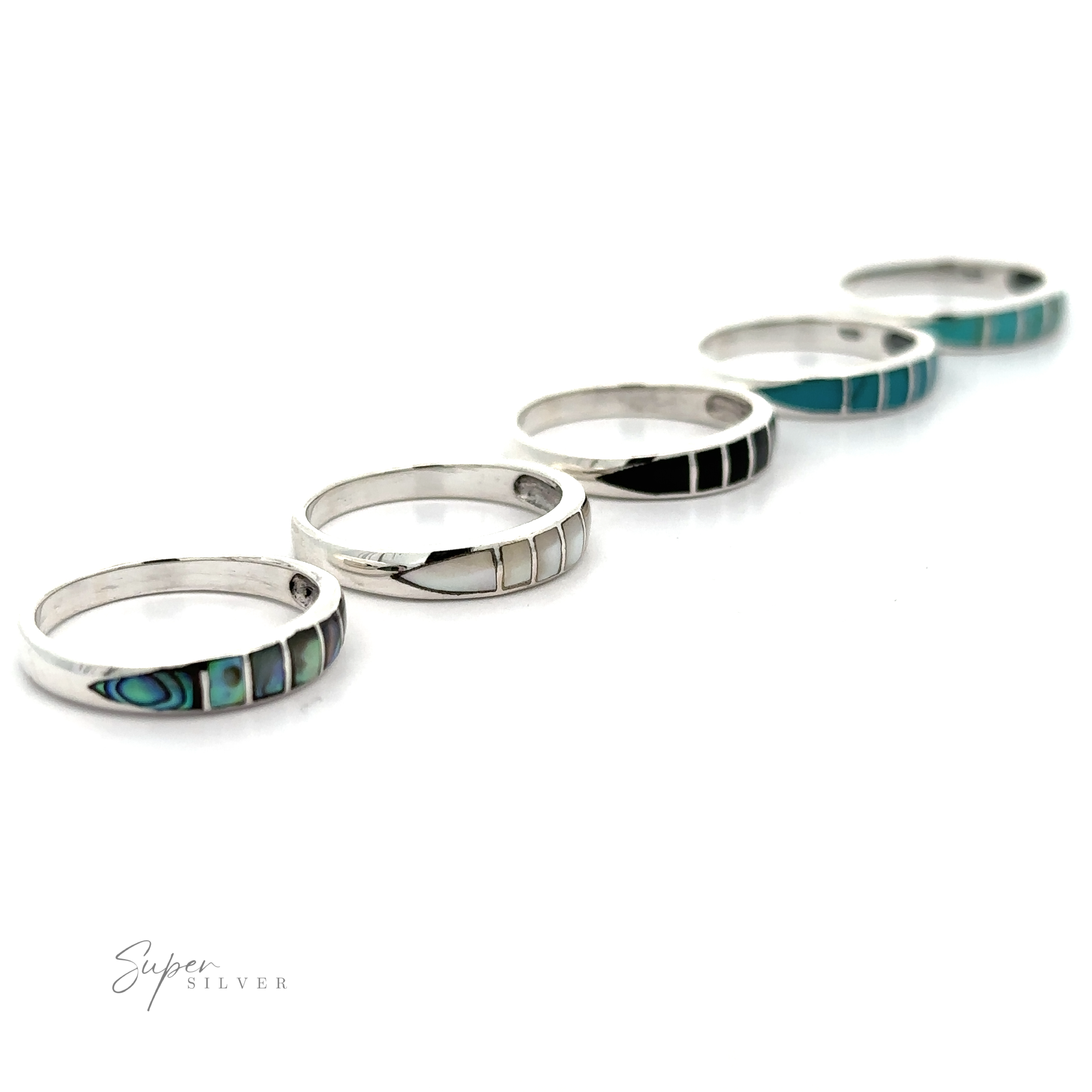 A striking row of sterling silver stacking Inlay Stone Bands with turquoise inlays.