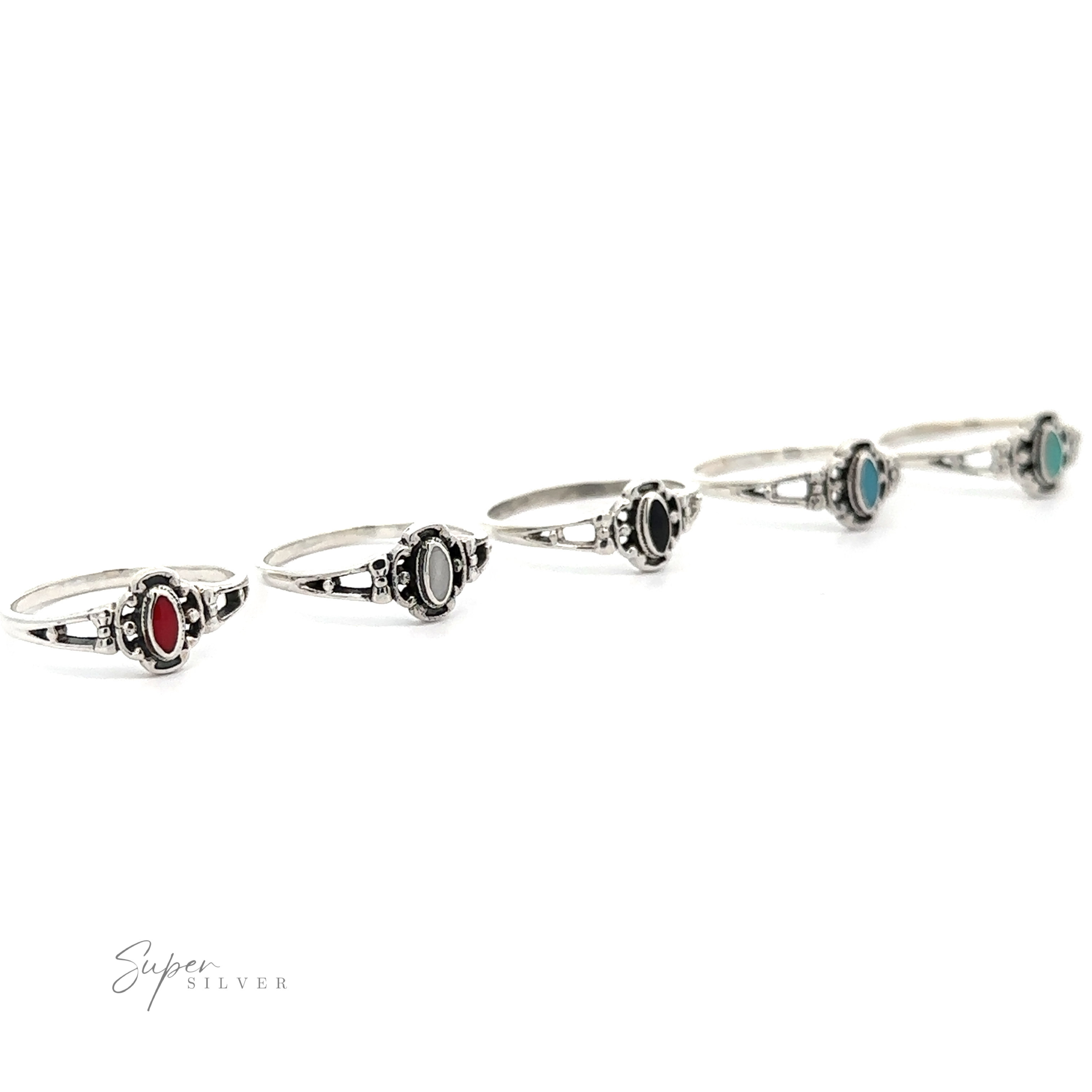 A row of Oval Inlay Stone rings with different colored oval stones, each adorned with a small bow.