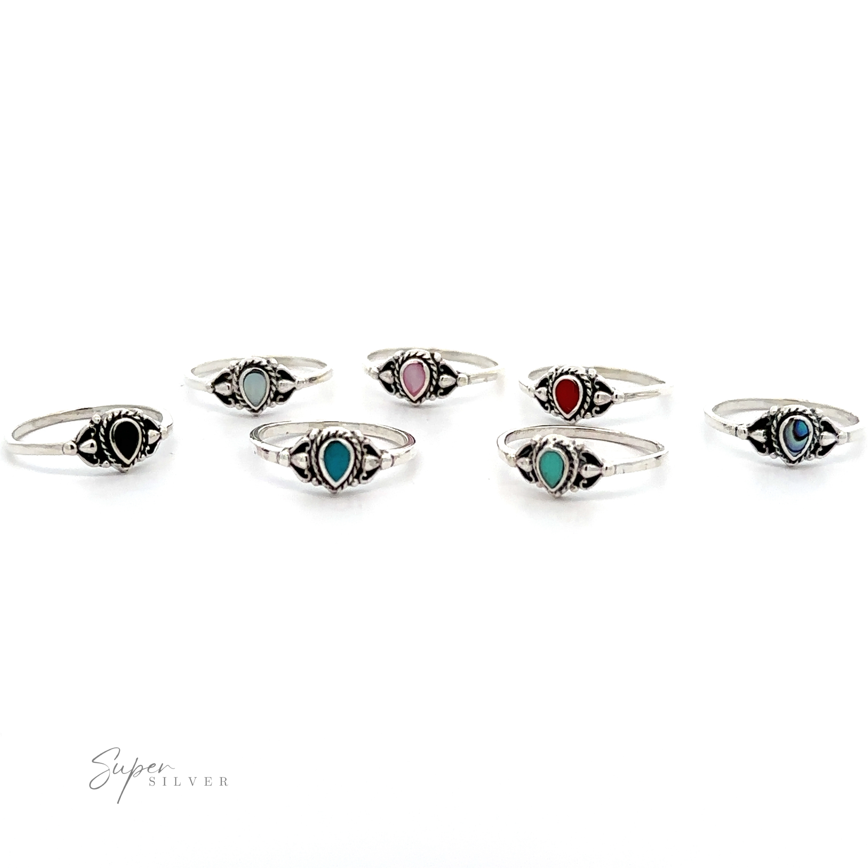 A set of seven Delicate Teardrop Inlay Stone Rings with Vintage Look, each adorned with a teardrop-shaped stone in black, light blue, pink, red, dark blue, turquoise, and green. The rings showcase an oxidized silver rope pattern and are arranged in a semi-circle on a white background.