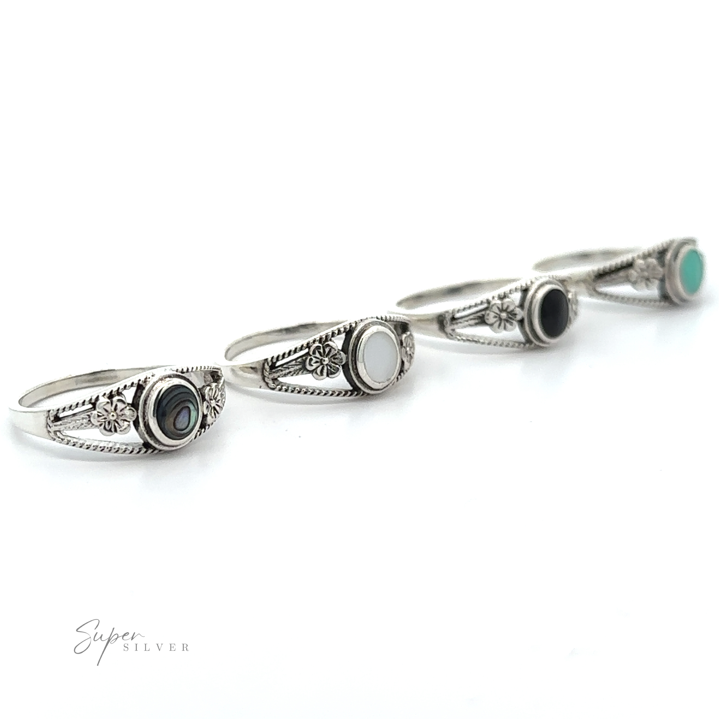 A set of four Inlay Stone Rings with Flower and Rope Design, available in various colors.