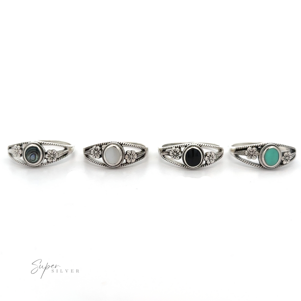A set of four Inlay Stone Rings with Flower and Rope Design