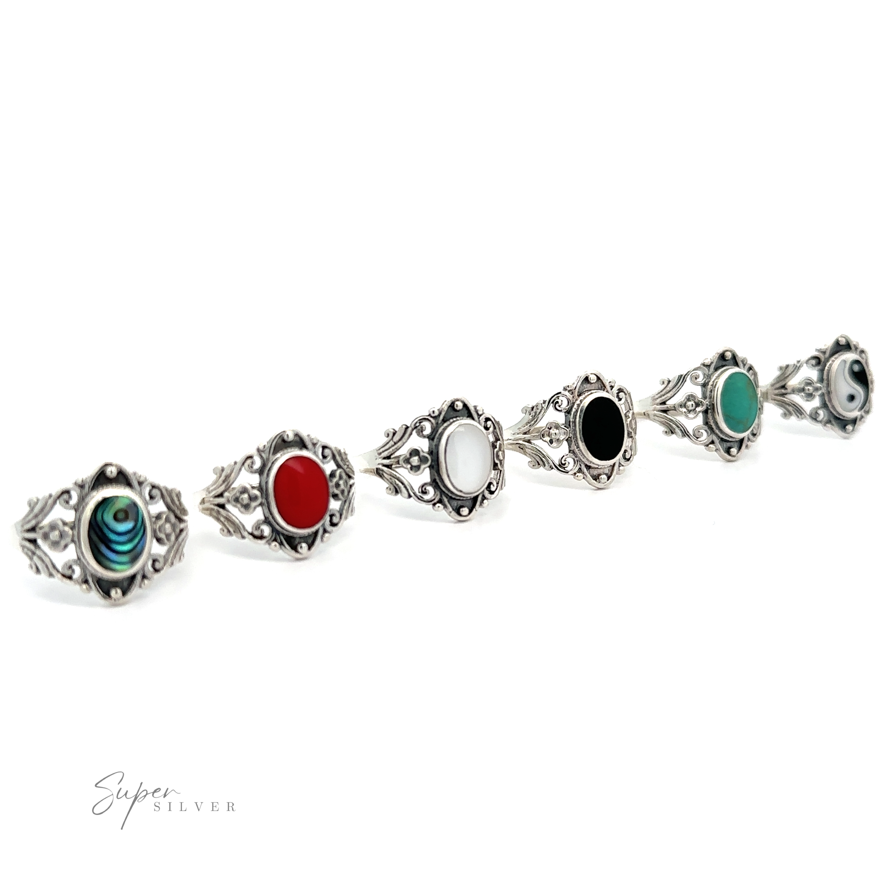 A row of Floral Filigree Inlay Stone Rings with turquoise stone accents.