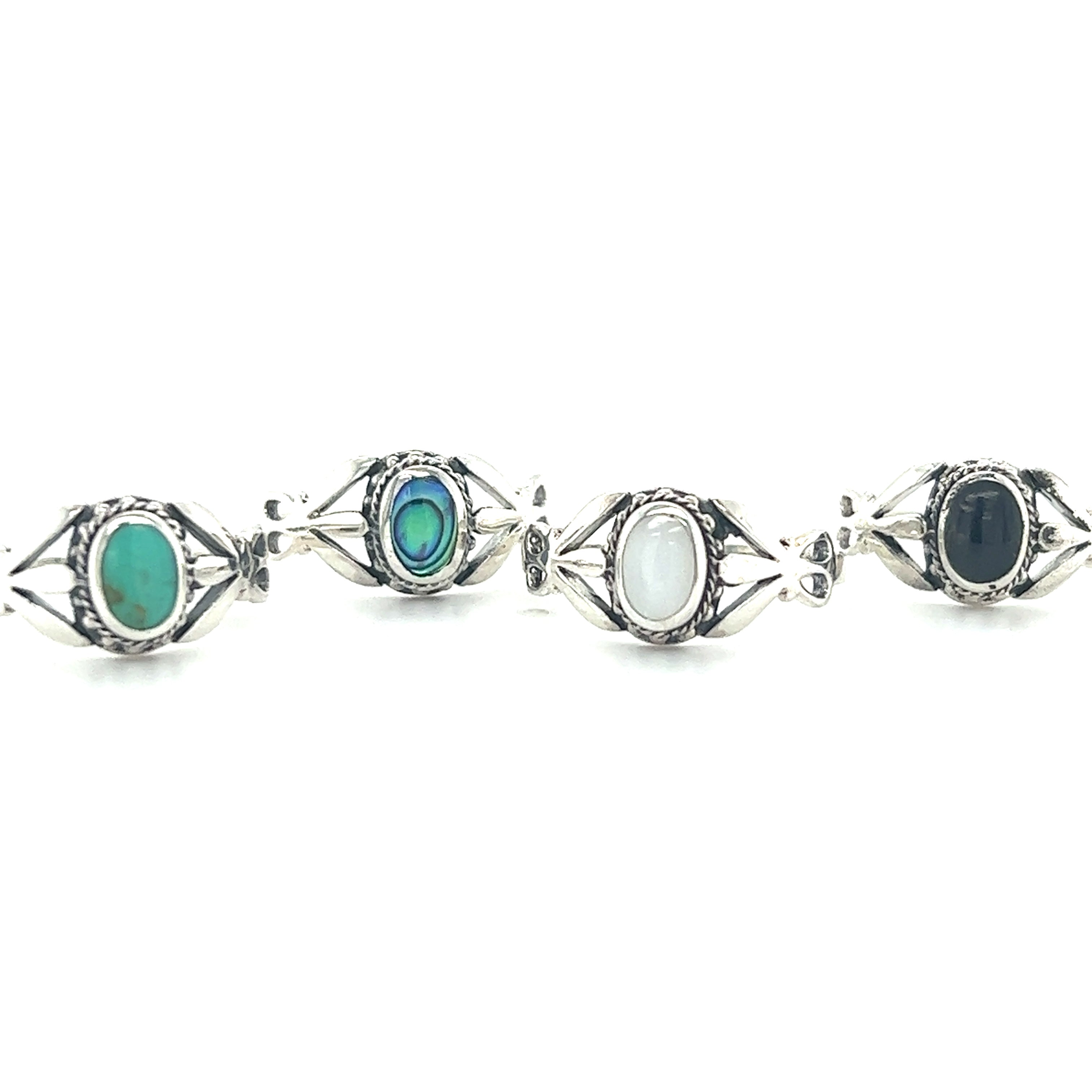 A set of three Super Silver Unique Oval Inlaid Stone Rings with black and white stones.