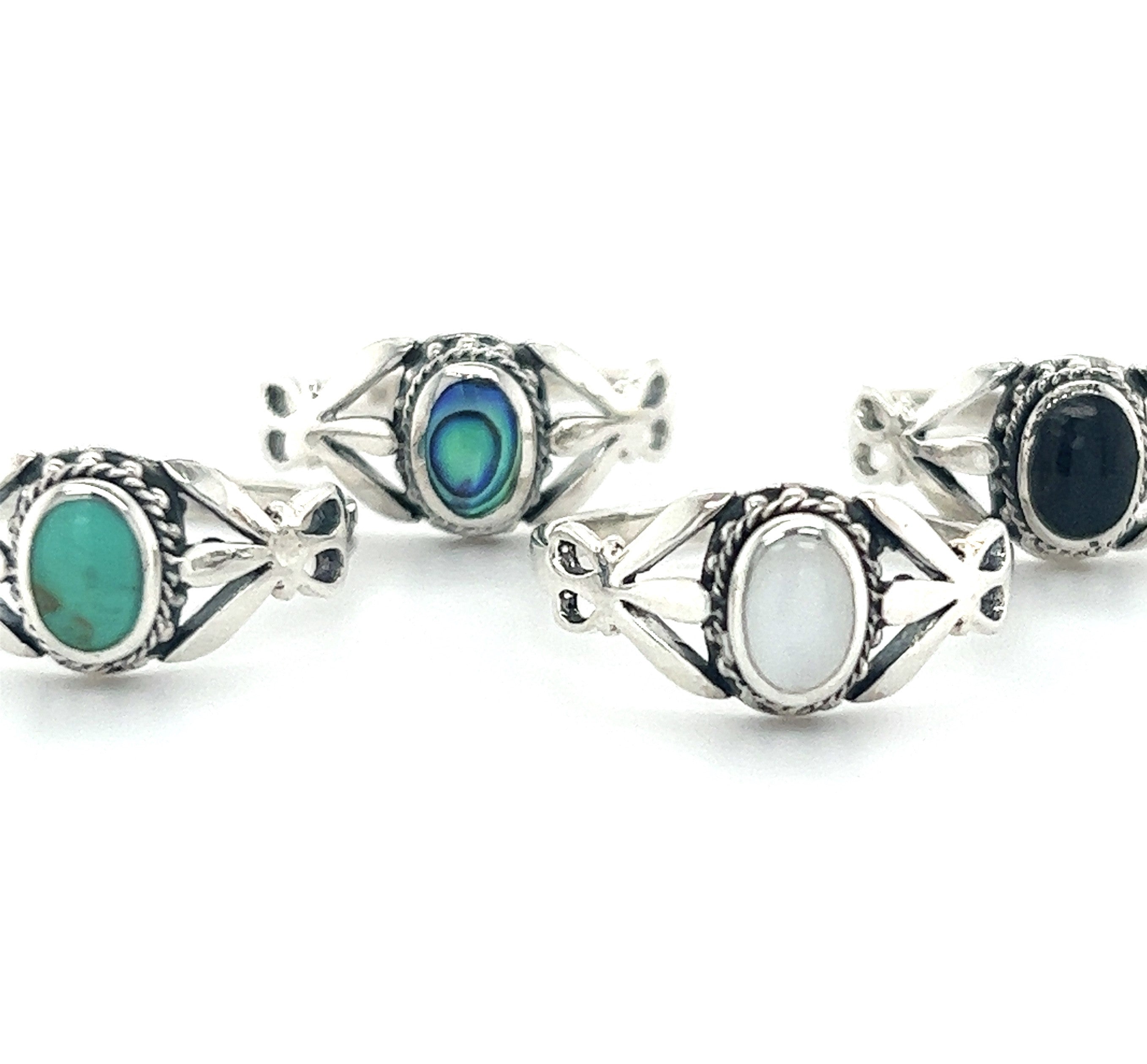 A collection of Unique Oval Inlaid Stone Rings.
