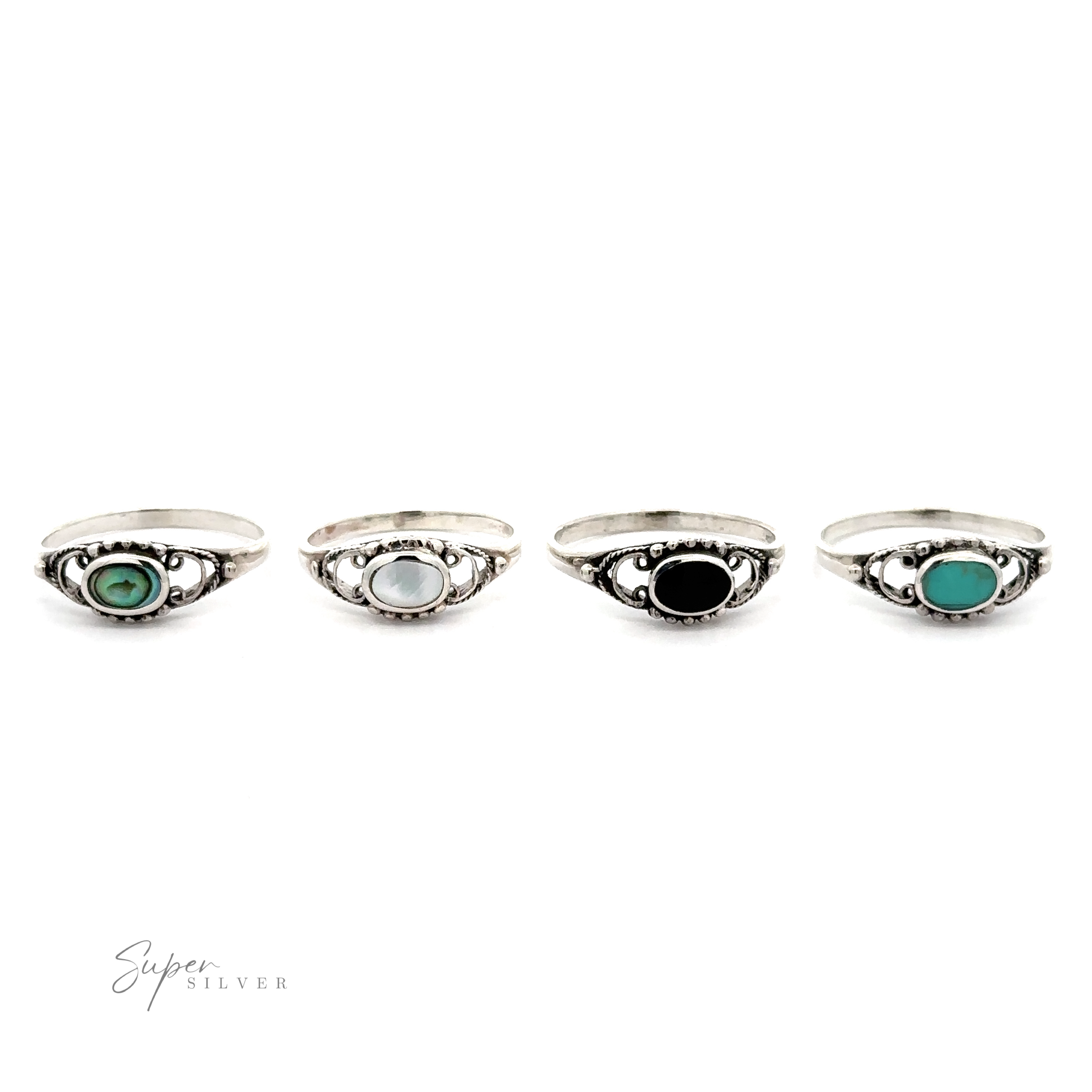 Four Oval Stone Rings With Delicate Border, featuring a ball pattern, on a white background.