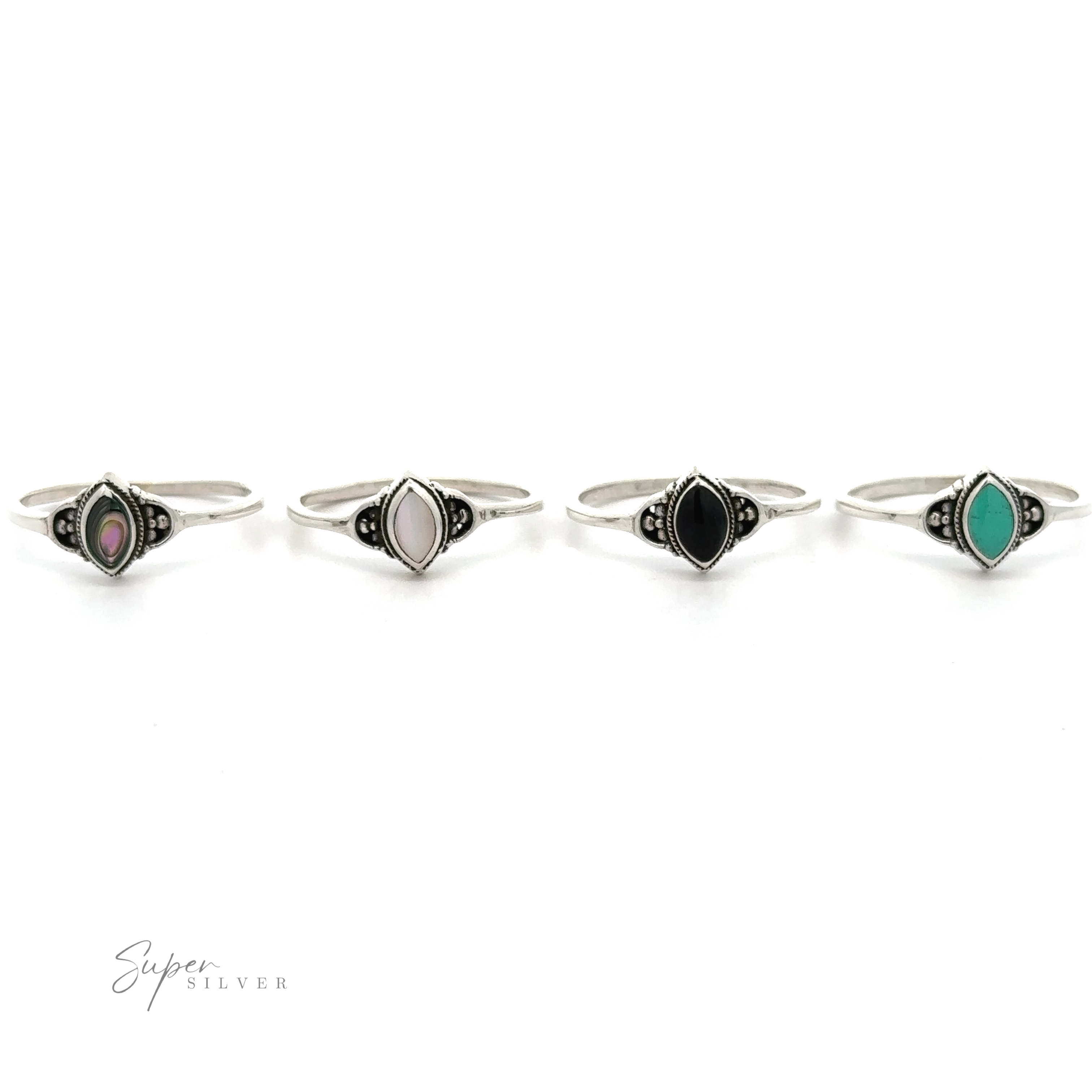 Four Delicate Marquise Inlaid Stone Rings with inlaid black, green, and blue stones.