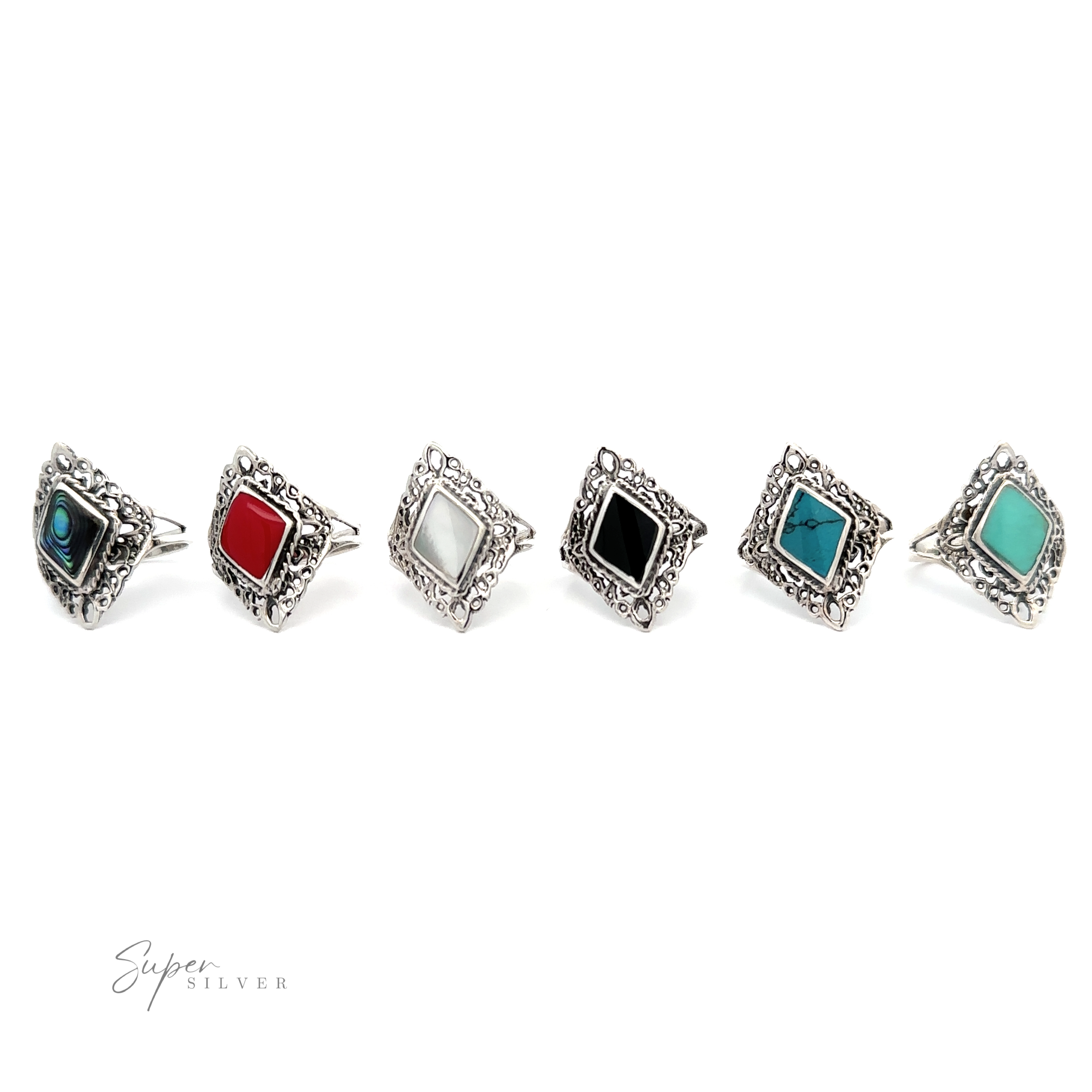 A row of Diamond Shaped Filigree Rings with Inlaid Stones in different colors.