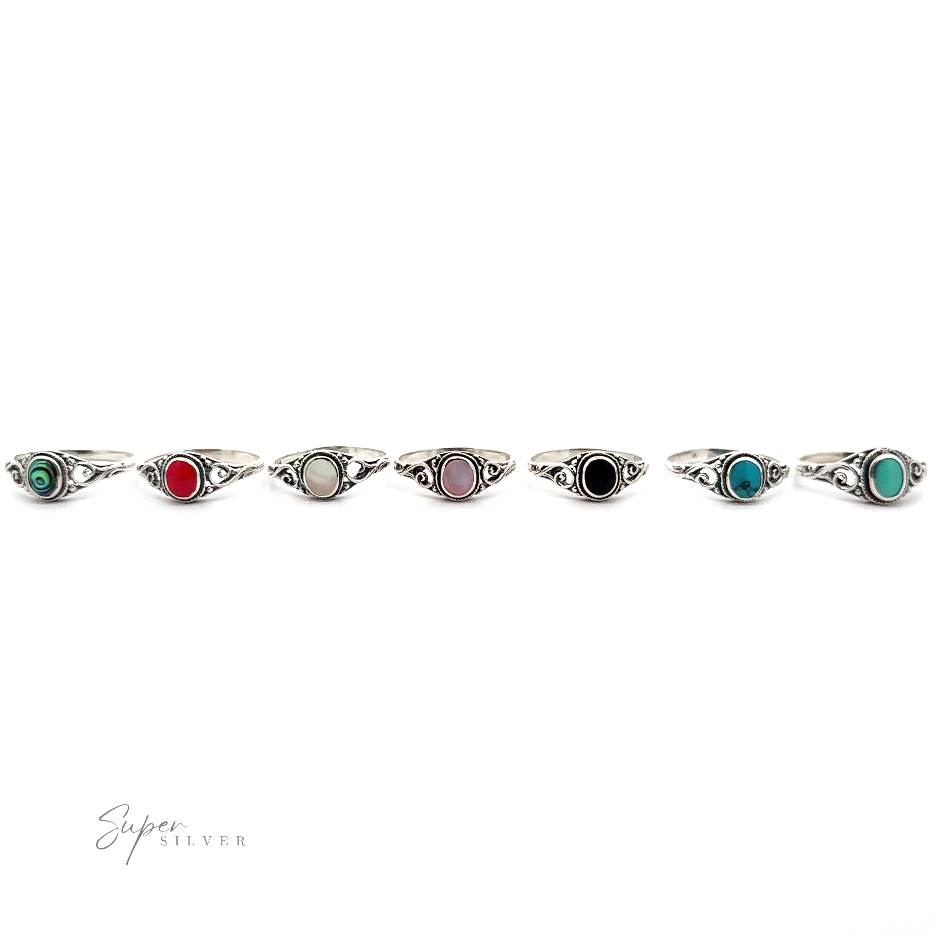 A row of Oval Inlay Stone Rings with Swirls in sterling silver.