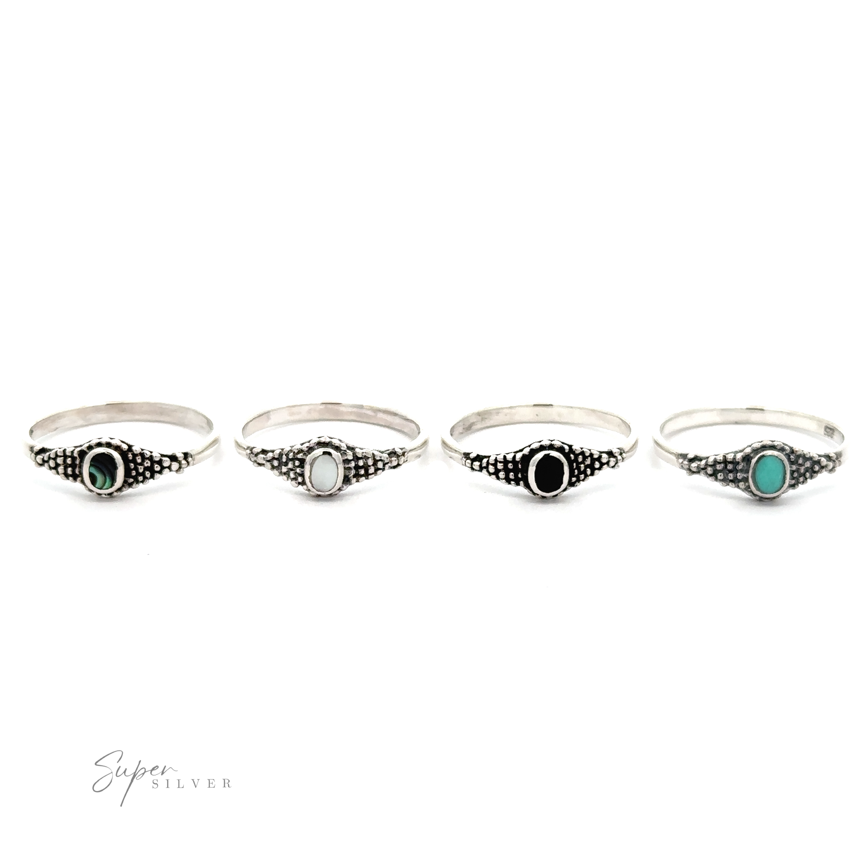 A set of four Dainty Inlaid Rings with Beaded Texture.