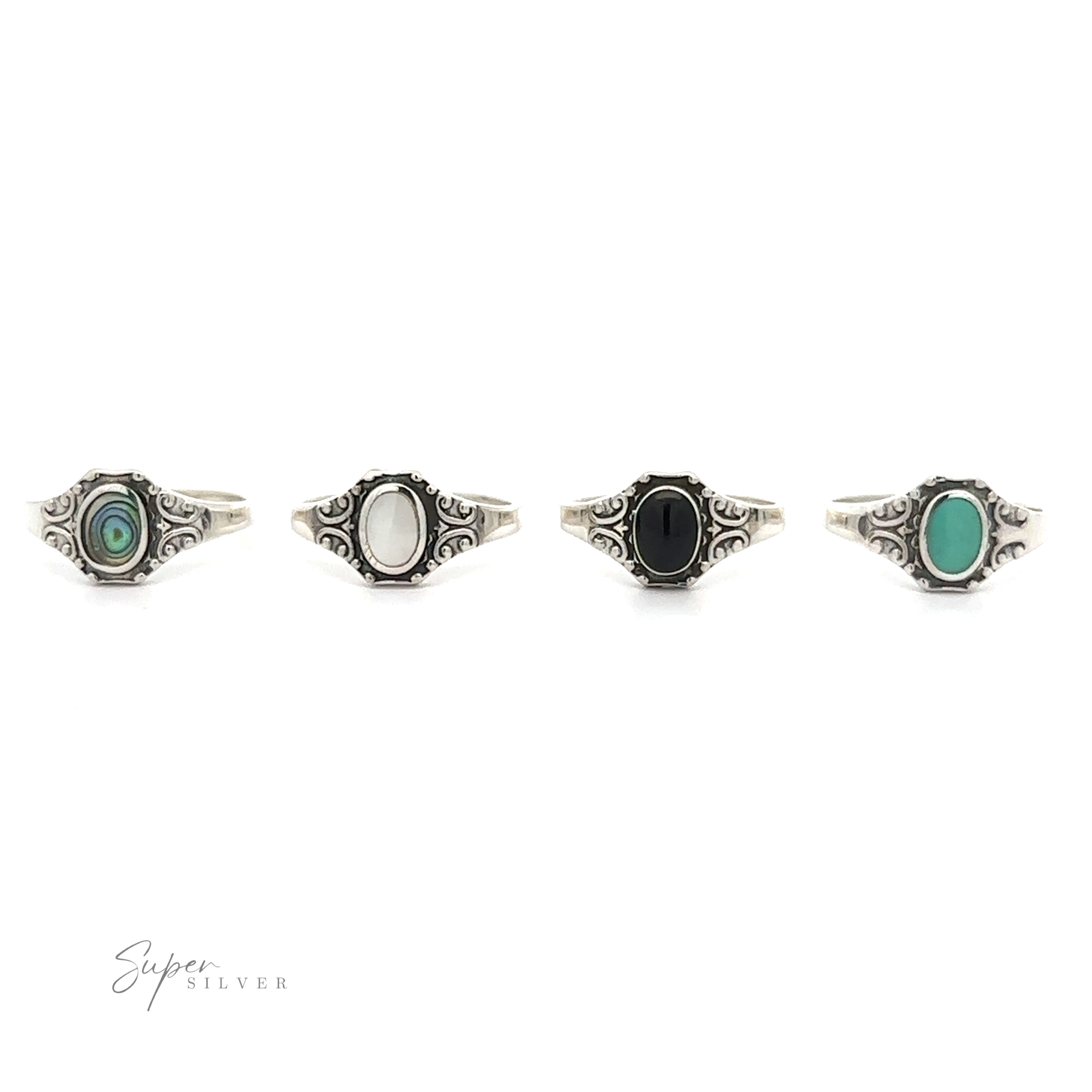 Four Oval Inlay Stone Rings with Antiqued Filigree Design in black, green, and white.