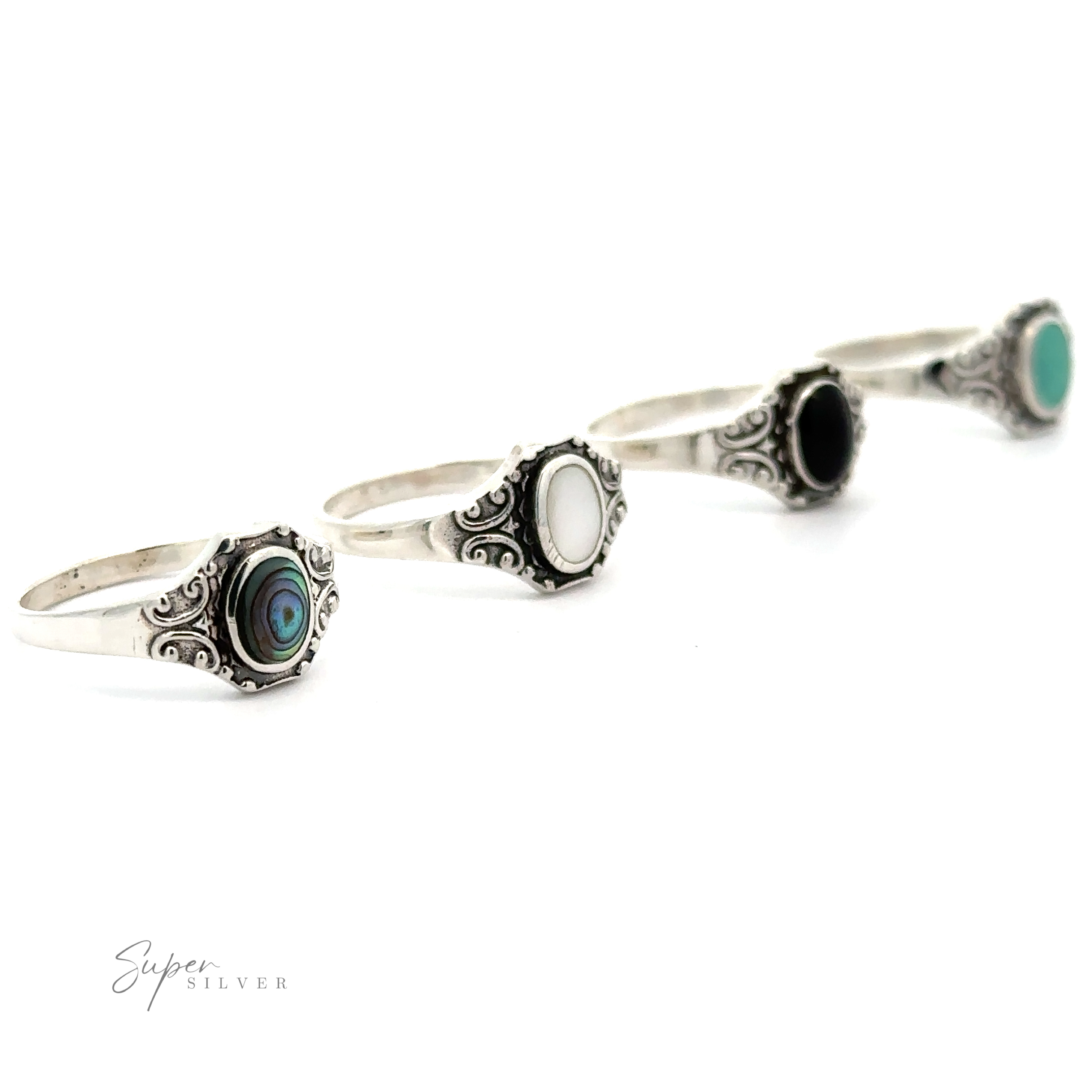 Four Oval Inlay Stone Rings with Antiqued Filigree Design.